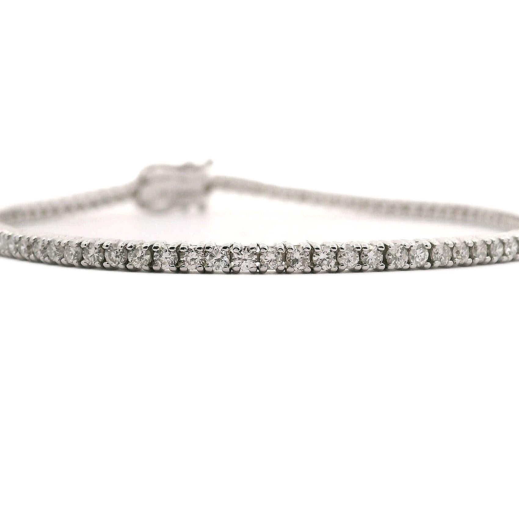 Condition:  Brand New
Metal:  14k White Gold
Weight:  7g
Length:  7 Inches
Width:  2.25mm
Diamonds:  Round Brilliant Diamonds 2cttw
Diamond Color and Clarity:  H-I and I1
Closure:  Box Tab Insert with Two Safety Latches
Markings:  