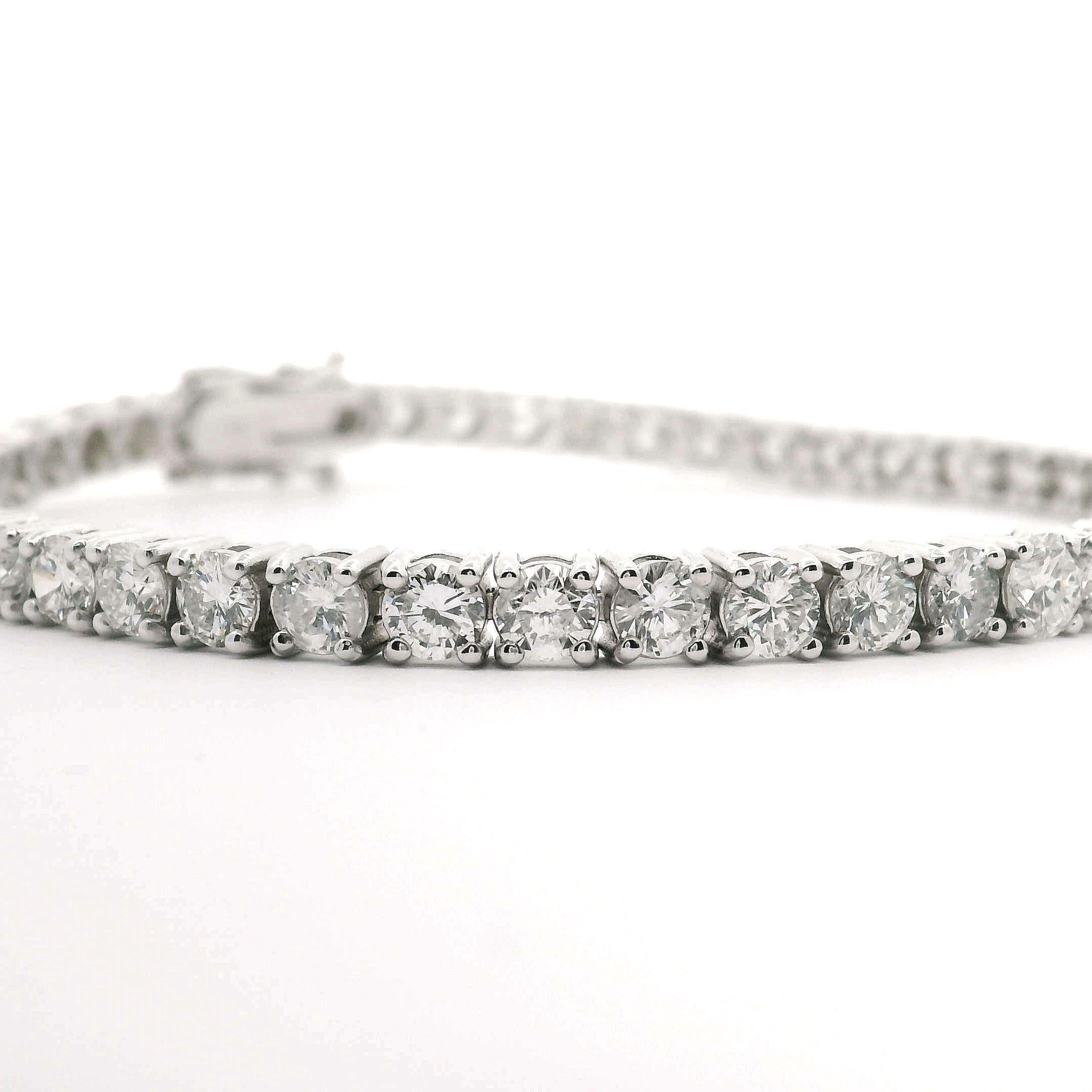 Condition:  Brand New
Metal:  14k White Gold
Weight:  12.1g
Length:  7 Inches
Width:  4mm
Diamonds:  Round Brilliant Diamonds 8cttw
Diamond Color and Clarity:  H and SI3-I1
Closure:  Box Tab Insert with Two Safety Latches
Markings:  