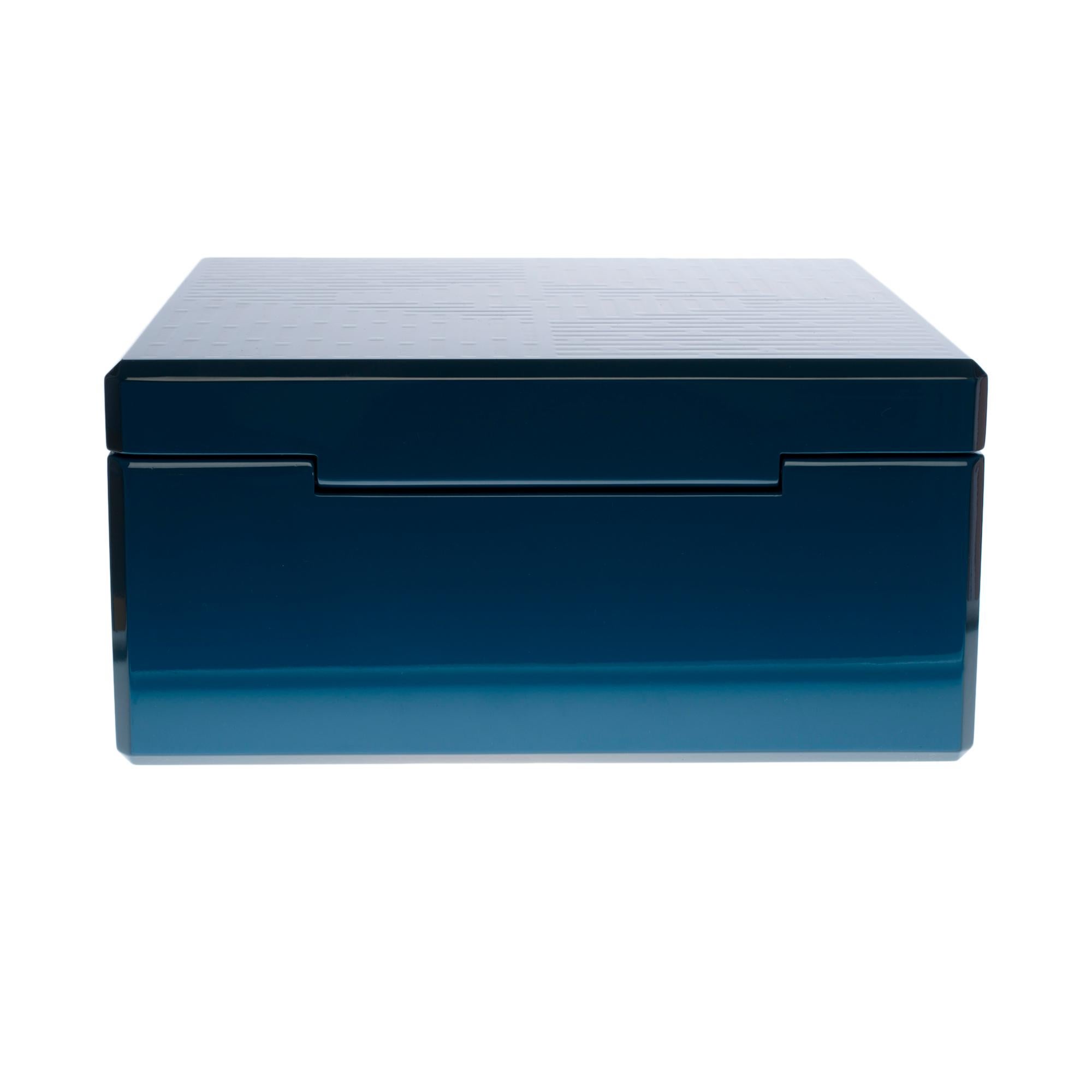Stunning Blue laser-engraved lacquered wooden jewelry and accessories case
Two removable trays wrapped with velvet goat in Italy
Can contain jewelry, watches, cufflinks and other accessories with 5 compartments on the 1st tray and 4 on the