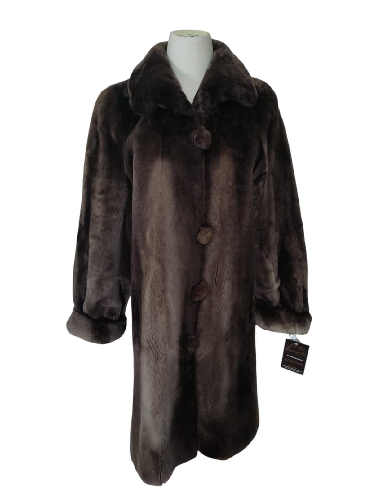 PRODUCT DESCRIPTION:

Brand New  Birger Christensen Sheared Beaver Fur Coat with Fur Trim (Size 14)

Brand new velvety Sheared Beaver fur phantom stroller coat with for cuffs and collar to hem.

Condition: new

Closure: Hooks & Eyes

Color: navy,