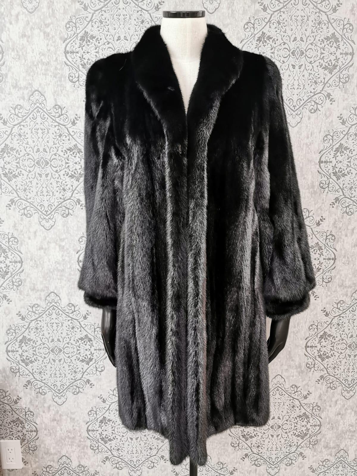 DESCRIPTION : PERFECT BRAND NEW BLACKGLAMA MINK FUR COAT SIZE 10

Portrait collar, supple skins, beautiful fresh fur, european german clasps for closure, too slit pockets, nice big full pelts skins in excellent condition.

This item is made in