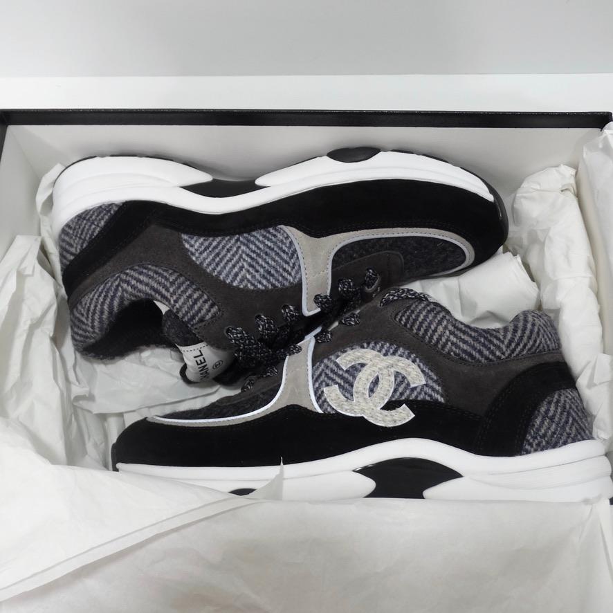 Brand new never been worn Chanel trainers with original box. In a neutral grey/black color palette, these sneakers never go out of style and are so chic.  The soft and luxurious fabrics with varying textures and tweed laces give these trainers the