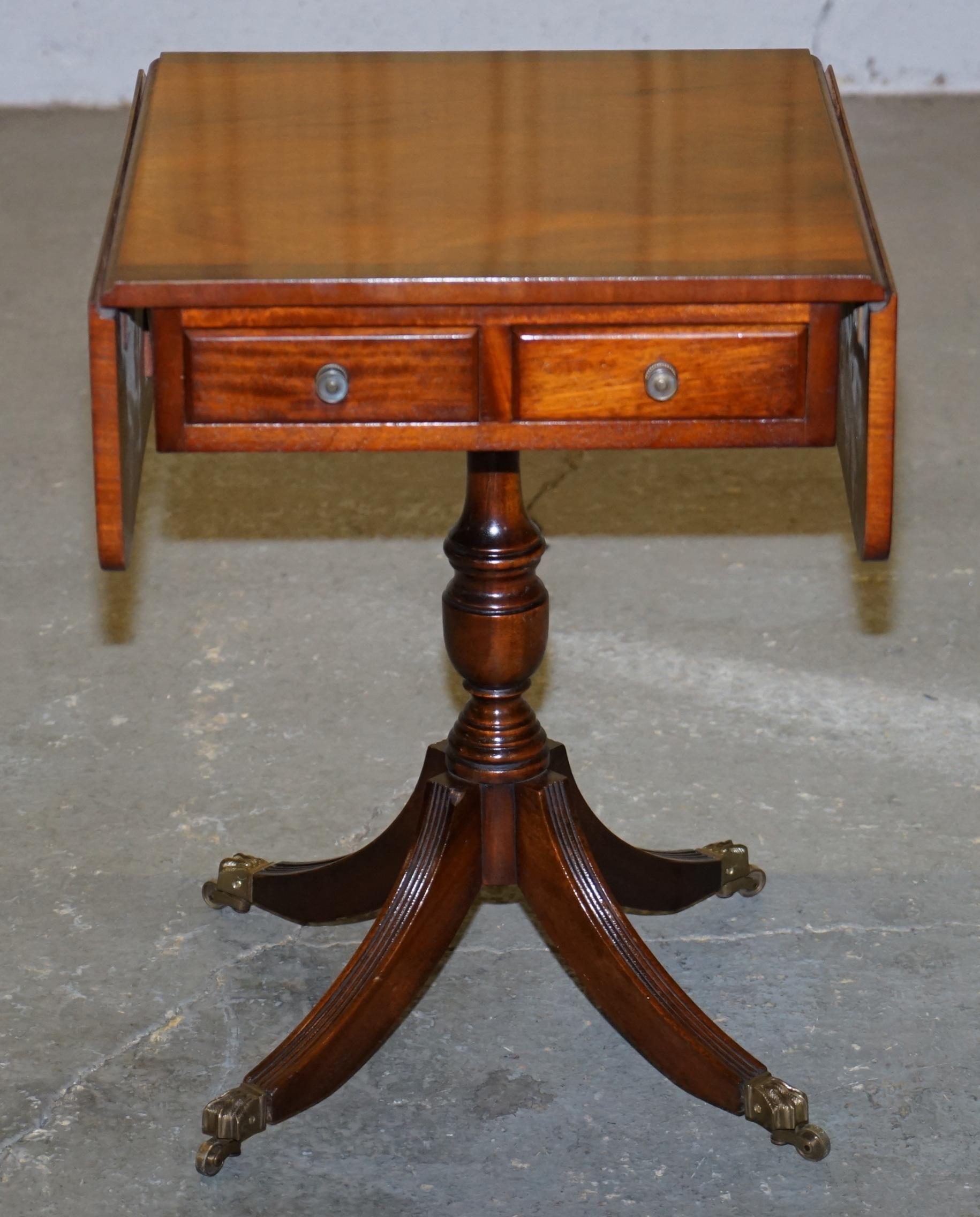 We are delighted to offer for sale this lovely brand new Bevan Funnell flamed mahogany side table with extending top twin drawers and solid brass lion hairy paw castors 

A very good looking and utilitarian piece, the table has twin drawers to the