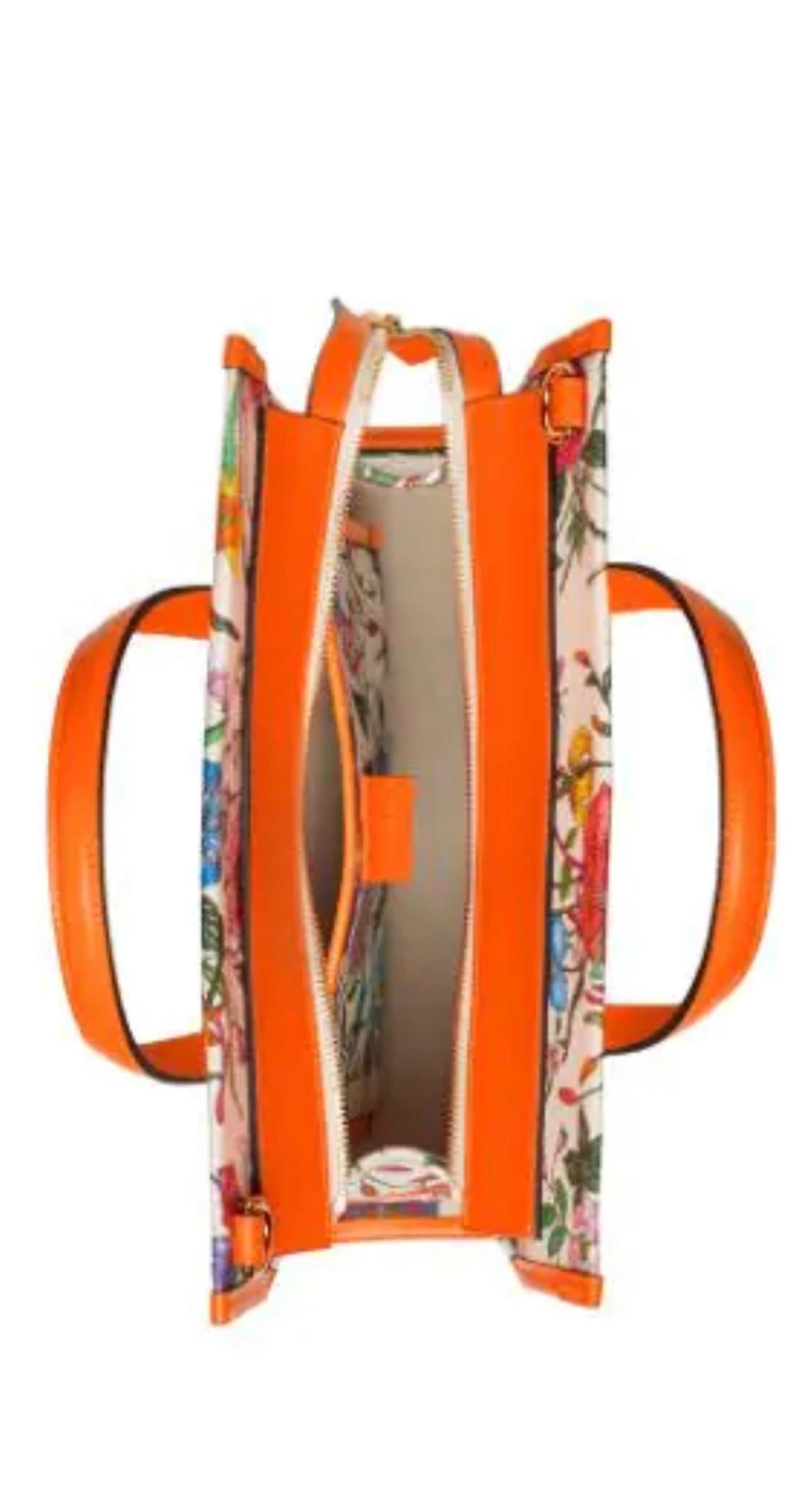 Flora medium leather-trimmed printed canvas tote
Latest and Hot 
Brand new Gucci Flora medium sized handbag. With an off white canvas with a bright colorful floral pattern. The tote features neon orange leather at the base, trim, and top handles and