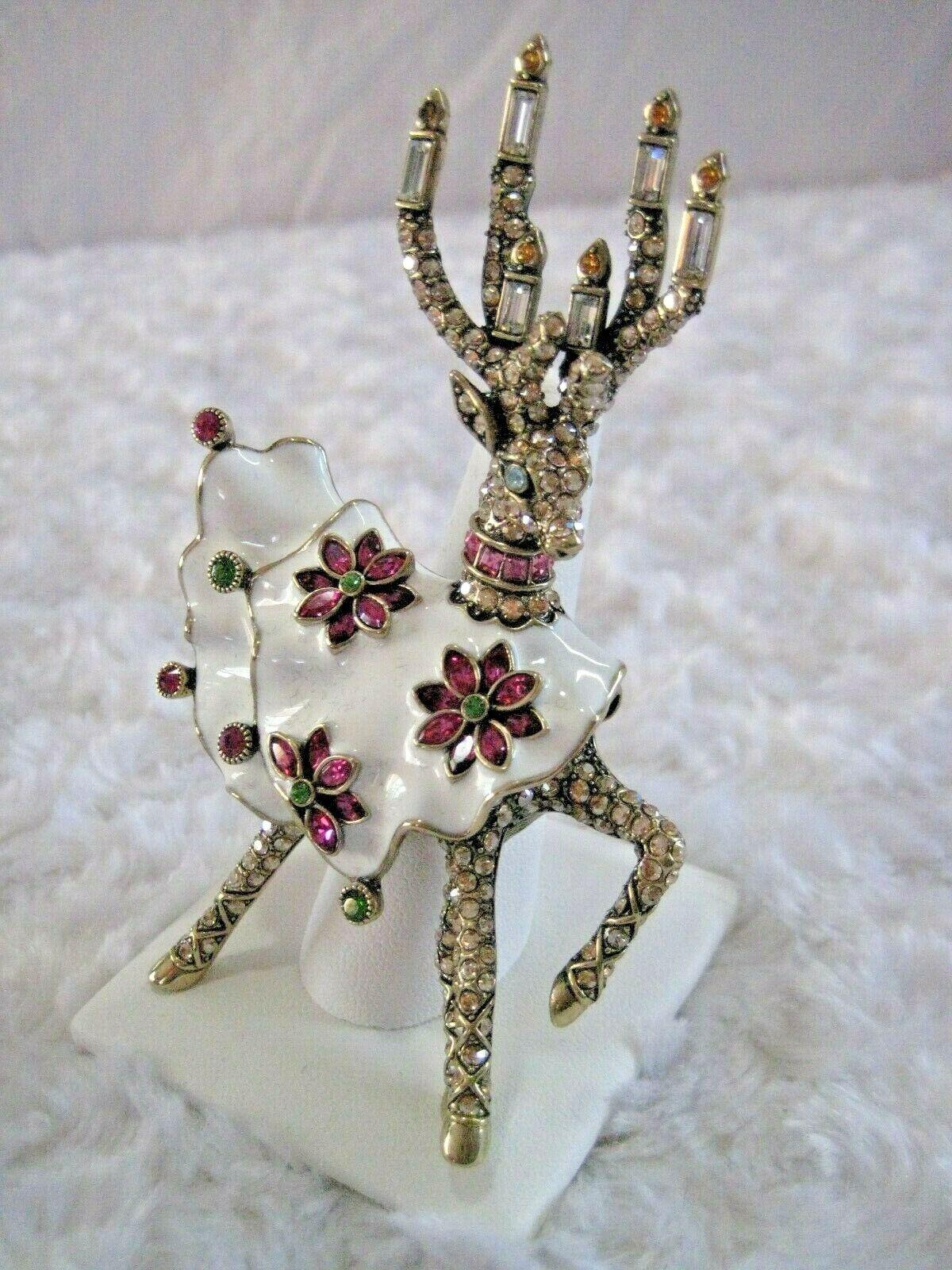Beautiful Holiday Deer Pin.

Pin Measures
approx.: 3 L X 2 L

Crystals
Crystal golden shadow, aquamarine, crystal, topaz, rose, fuschia, fern green and white enamel

Metal Color:
Bronze tone
Findings:
Joint-and-catch closure
Finish:
Oxidized,