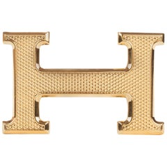 Brand new Hermès belt buckle model "Guillochée" in shiny gold !
