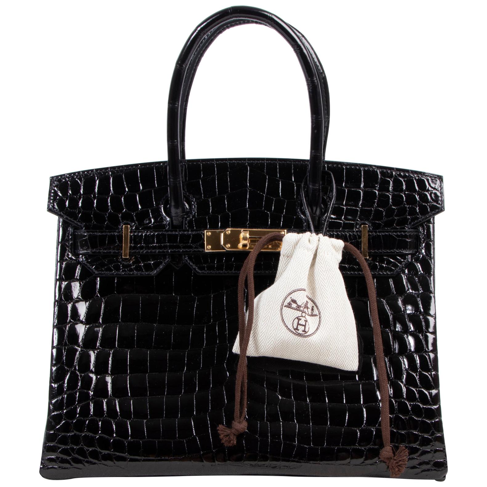 BRAND NEW

Hermès Birkin 30 Crocodile Niloticus Lisse Noir GHW

The real lover of luxury will feel his or her heart beat faster upon seeing this gorgeous Hermès Birkin 30 Crocodile Niloticus Lisse Noir GHW. The shiny black crocodile hide is exotic