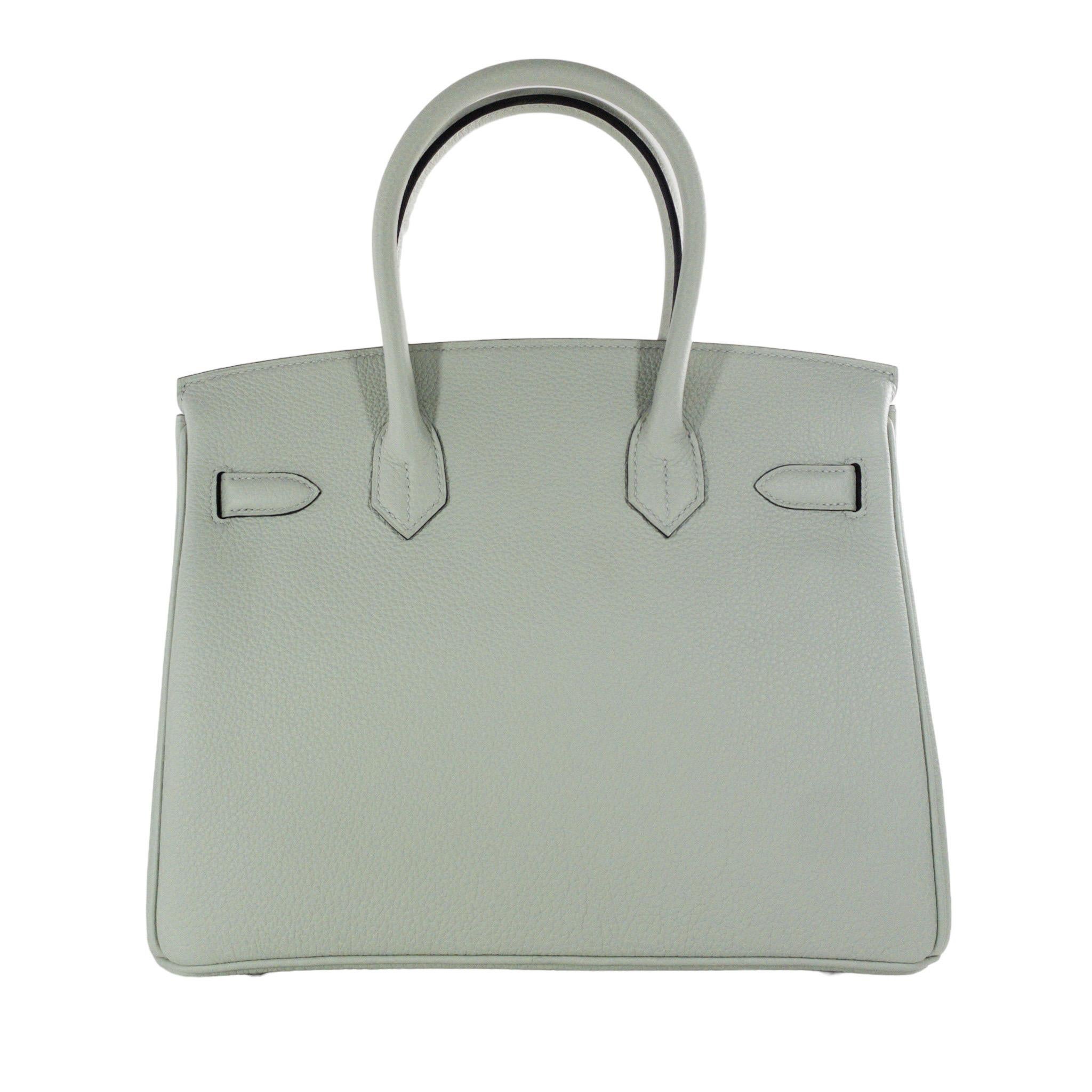 Consign of the Times presents this brand new in box Hermes Birkin 30 in Gris Neve Togo leather with Palladium hardware. This is a new stunning color by Hermes for the 2023 spring summer season.  All hardware is sealed.  This bag features double