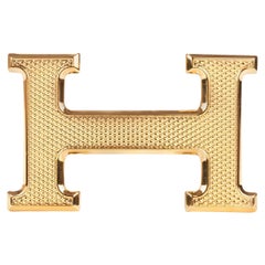 Brand new Hermès "Guillochée" belt buckle  in shiny gold metal 