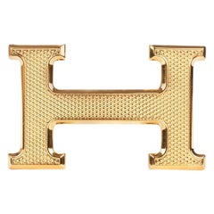 Brand new Hermès "Guillochée" belt buckle  in shiny gold metal 