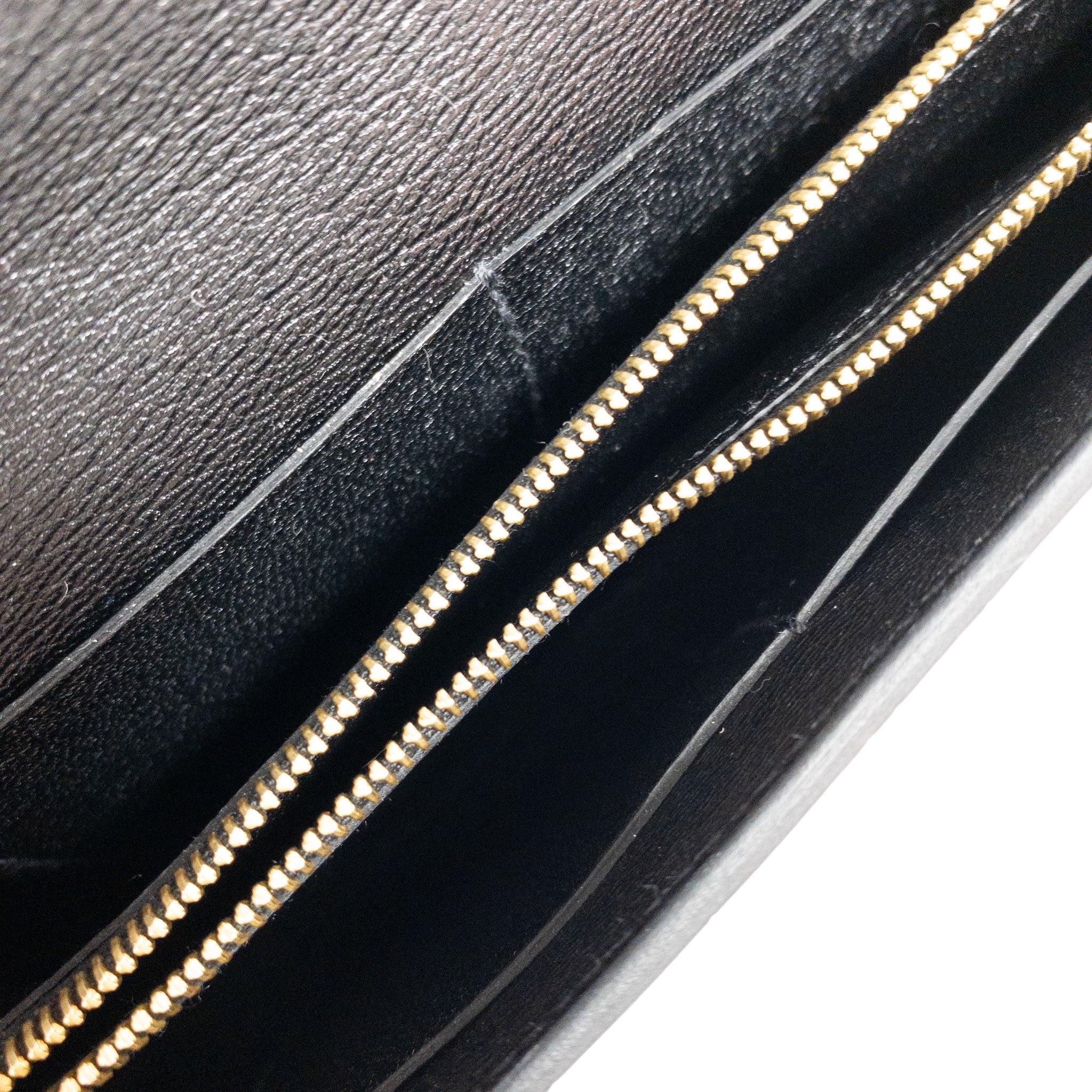 Consign of the Times presents this Hermes Kelly To Go Wallet with strap in black shiny Mississippian Alligator. Detachable leather strap. Four interior card slots and zipped compartment inside. Lined with leather.  

Size: 8 x 4.5 x 1 Drop-