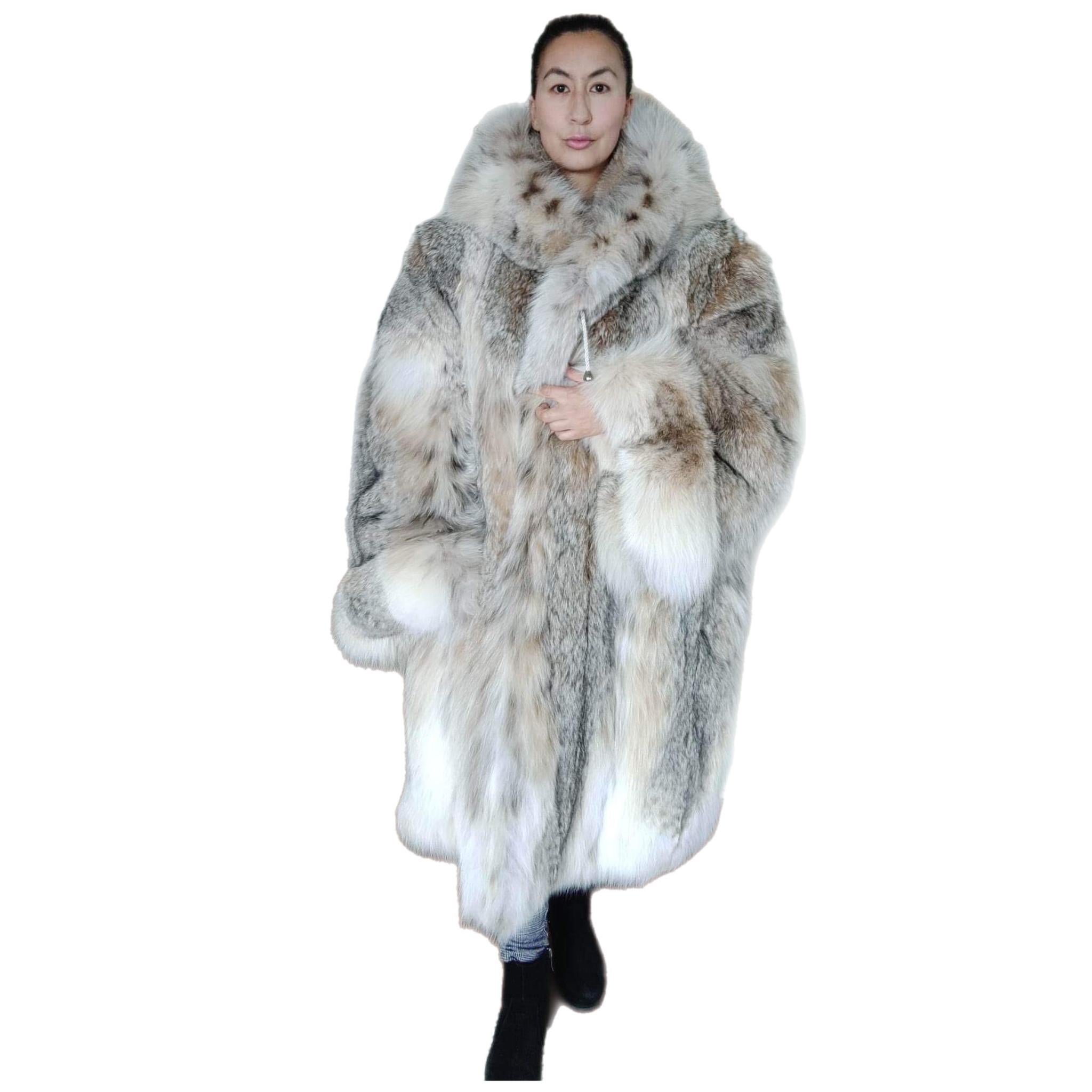 DESCRIPTION : Brand new Canadian lynx fur coat with detachable hood size 12/L

Huge portrait collar, straight sleeves, integraded belt, double fur hood, supple skins, beautiful fresh fur, european german clasps for closure, too slit pockets, nice