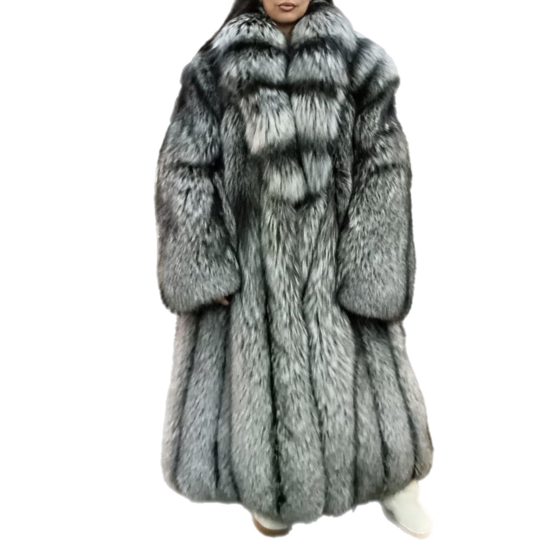 DESCRIPTION : Brand new lightweight saga silver fox fur coat size 18 L

Rare island fox coat. Tailored collar, straight sleeves, supple skins, beautiful fresh fur, european german clasps for closure, too slit pockets, nice big full pelts skins in