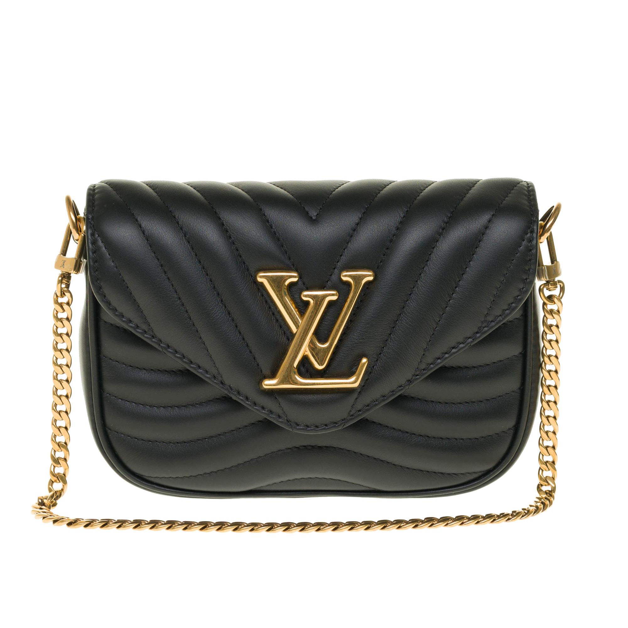 SOLD OUT- Limited Edition - Unavailable

This Louis Vuitton New Wave multi-pouch is made of quilted calf leather. This contemporary bag is topped with a golden chain that offers a hand or shoulder carry. Its wide bag strap is embroidered with the