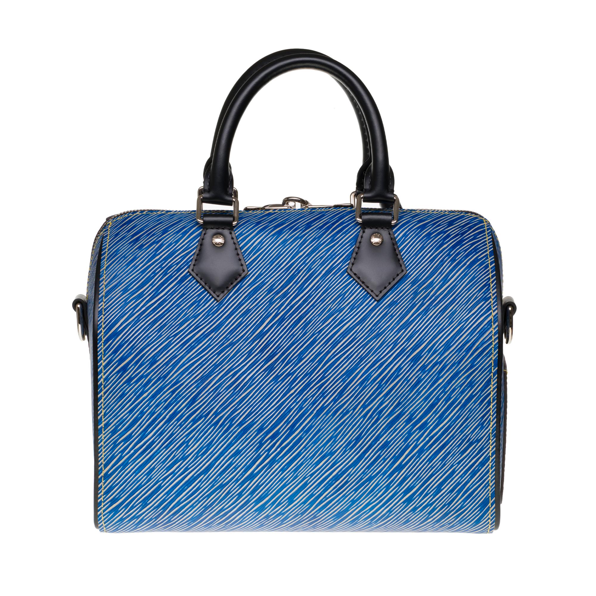 Speedy Bandouliere 25 Denim Light tote is finely crafted of Louis Vuitton signature textured epi leather in blue and white. The shoulder bag features black rolled leather top handles and an optional, adjustable shoulder strap with polished silver