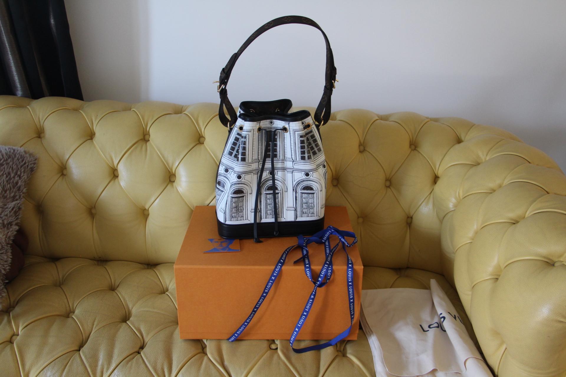 The Noé MM Architettura bucket bag in printed matte calfskin comes from the LVxFornasetti capsule, a collaboration between Louis Vuitton and the distinguished Italian design atelier. The smooth leather mimics stone, upon which imaginary buildings