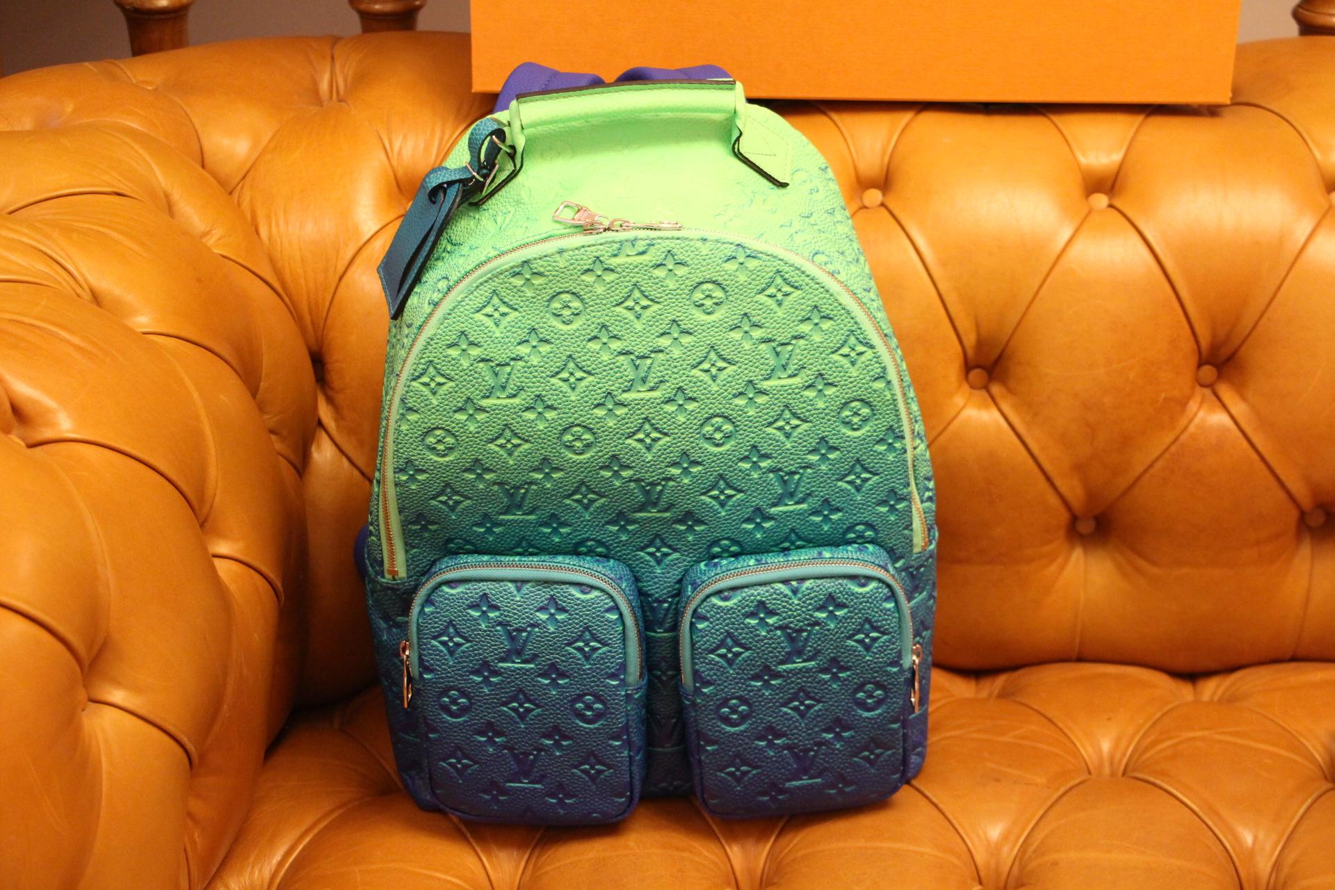 This extraordinary Louis Vuitton Multipocket Backpack has got very unique color gradient in fluorescent finish. When you look at it, you've got a feeling of an optical illusion with very changing and vivid colors. Made from Virgil Abloh’s new