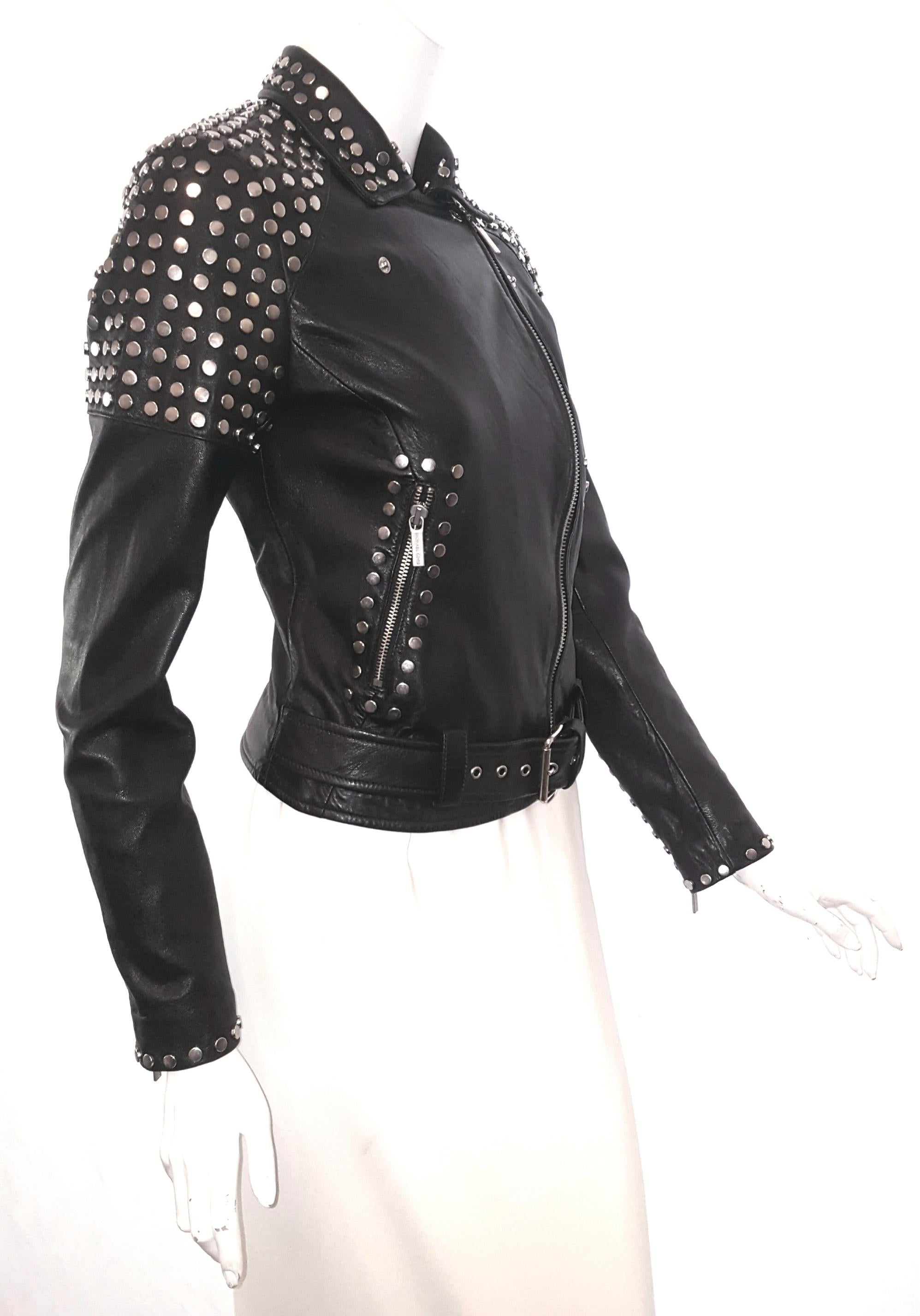 Brand new Michael Kors silver studded black leather bomber jacket with notch collar and belt at front.  Two zippered slit pockets, zippered cuffs and asymmetric zipper at front for closure finishes this classic trendy look.  This jacket is covered