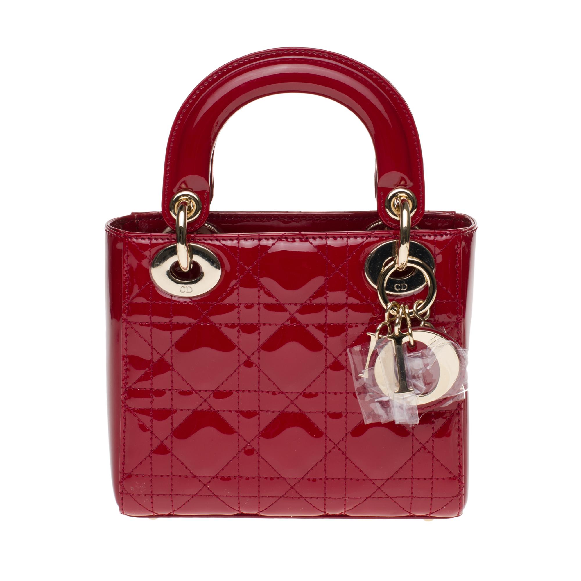 The Lady Dior handbag embodies elegance and beauty according to M. Dior: feminine and refined, timeless and modern. Crafted from cherry red patent lambskin leather and covered with the emblematic cannage motif, its quilting is instantly