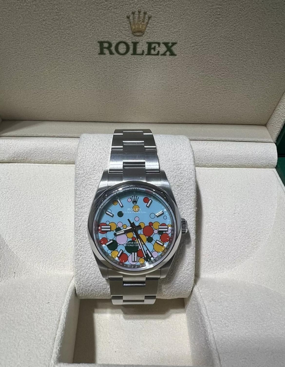 This brand new in box Rolex oyster perpetual celebration dial edition 36mm wristwatch is a stunning luxury timepiece. The watch is made with high-quality stainless steel and features a sapphire crystal and mechanical automatic movement. It is a