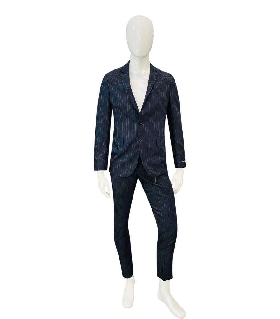 Brand New - Versace Suit - Jacket & Matching Trousers

Dark blue and black with a diamond/harlequin detailing 

through out. Black logo buttons to the closure and cuffs 

of the jacket. Gold chain trim to cuff. Rrp approx £3,000

Size -