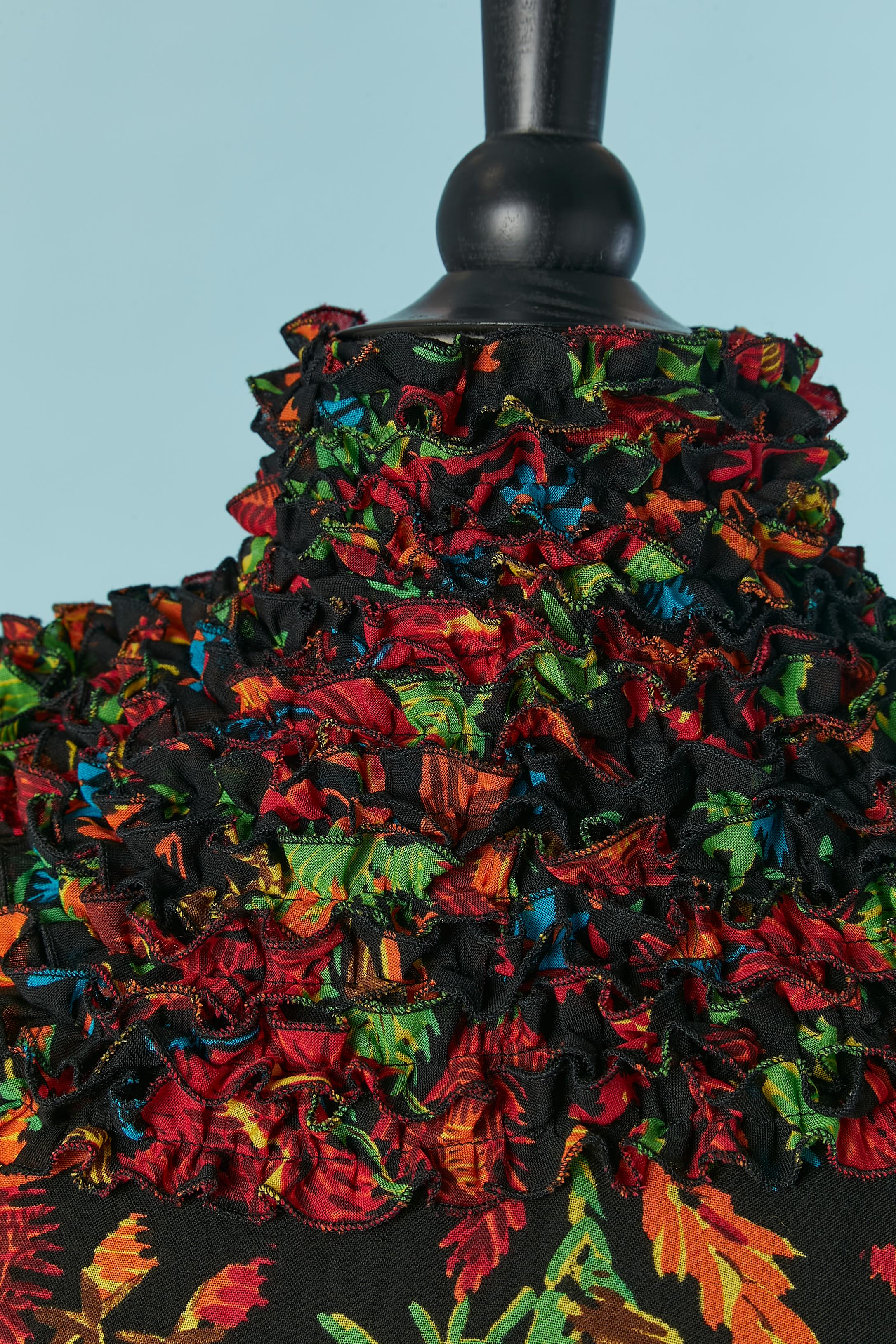 Wool dress with flower print and ruffles around the neck, on the bottom edge and on the sleeve edge. Main fabric composition: 70% wool, 18% polyester, 12% nylon. Invisible zip on the middle back.
No indication for lining composition but probably