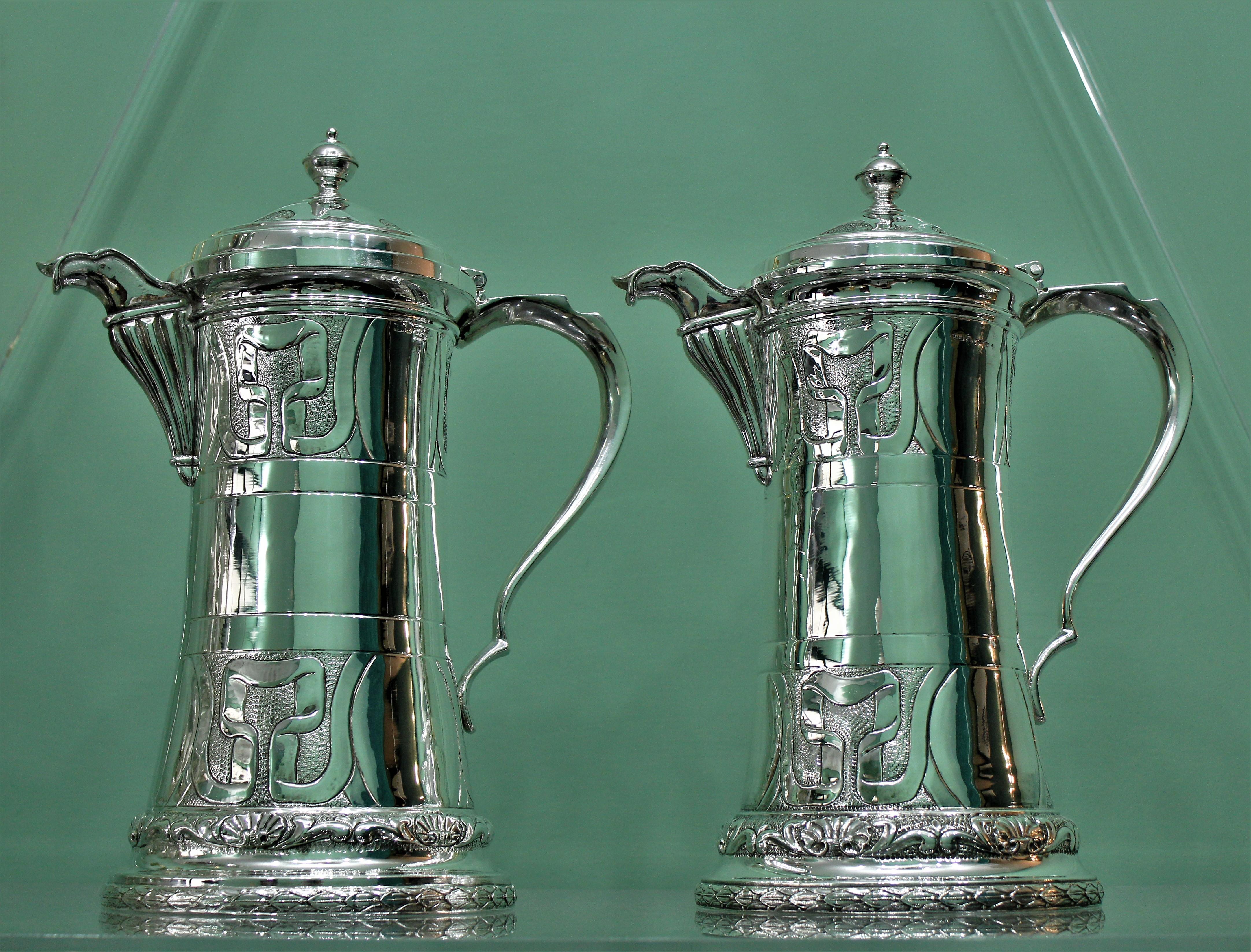 Pair of silver cocktail pitchers with cover realized by the famous silversmith Brandimarte from Florence, circa 1950s.
Impressive size (H:35.5 cm W: 28 cm Weight 3.900 gr.) engraved and worked by hand.
Very nice work and quality, perfect