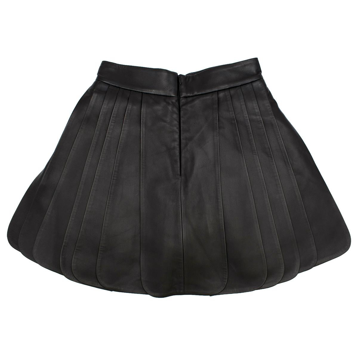 Brandon Maxwell Pleated Leather Mini Skirt in Black

- Black leather pleated skirt 
- Silk short underneath
- Hidden zip fastening to the middle back 

Please note, these items are pre-owned and may show some signs of storage, even when unworn and