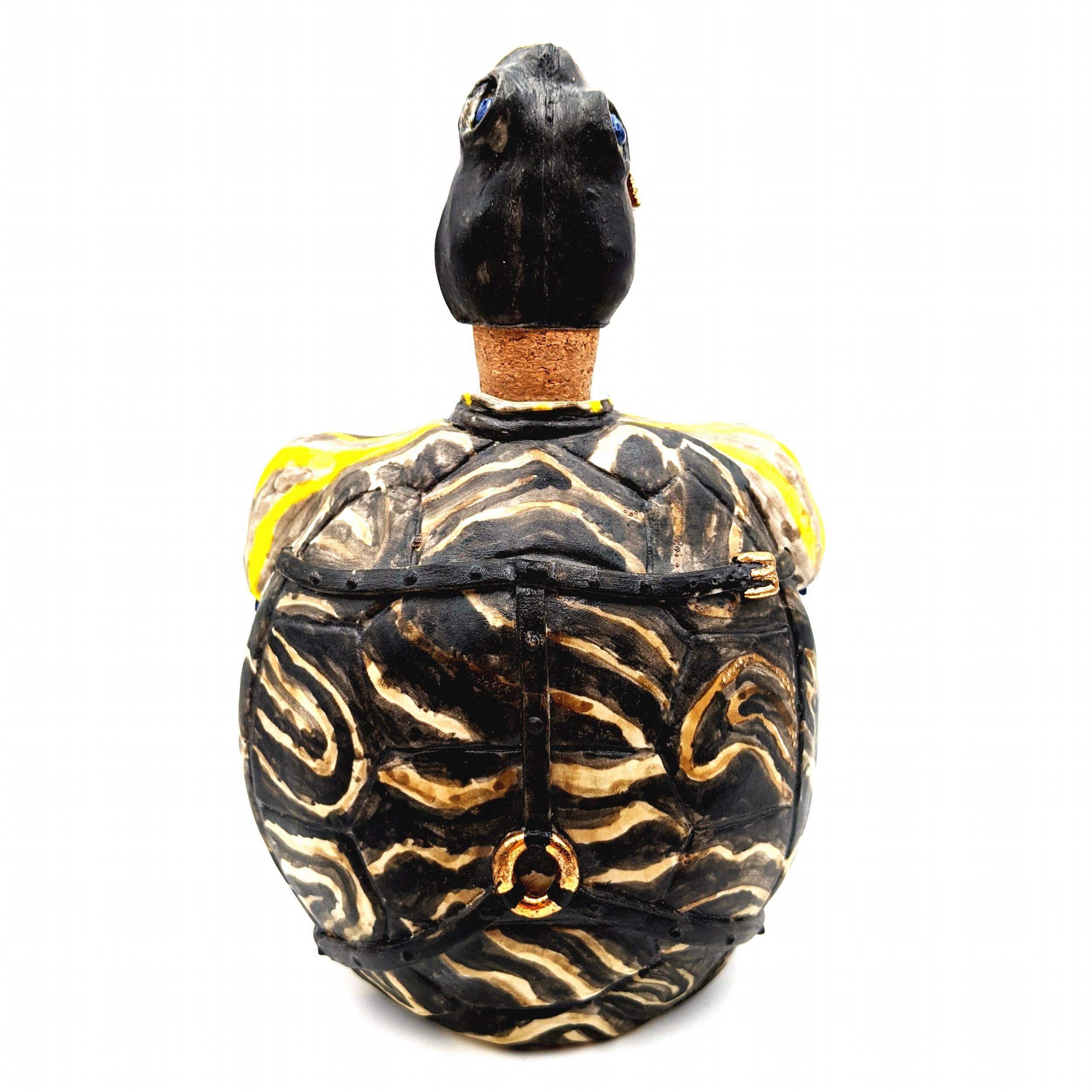 Title : Yours For The Taking Turtle Flask
Materials : Porcelain, Steel, Cork, Luster
Date : 2017
Dimensions : 7.5x5x2
Description : Functional 10oz Flask, Slipcast and Handbuilt Cone 10 porcelain, Oxide, Slip and Gold Luster decoration. Cork and