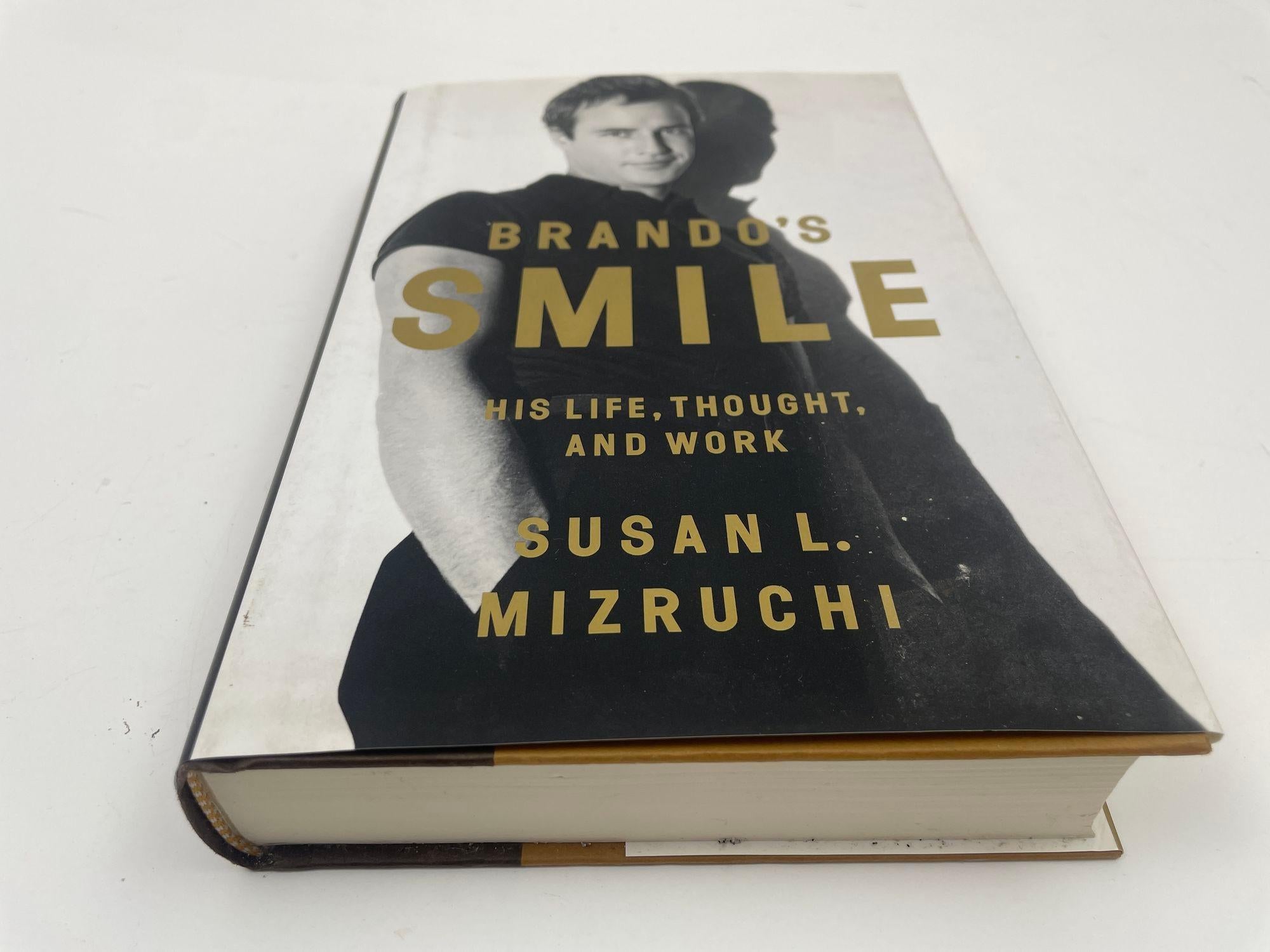 Brando's Smile His Life Thought and Work Hardcover Book by Susan L. Mizruchi.A groundbreaking work that reveals how Marlon Brando shaped his legacy in art and life.When people think about Marlon Brando, they think of the movie star, the hunk, the