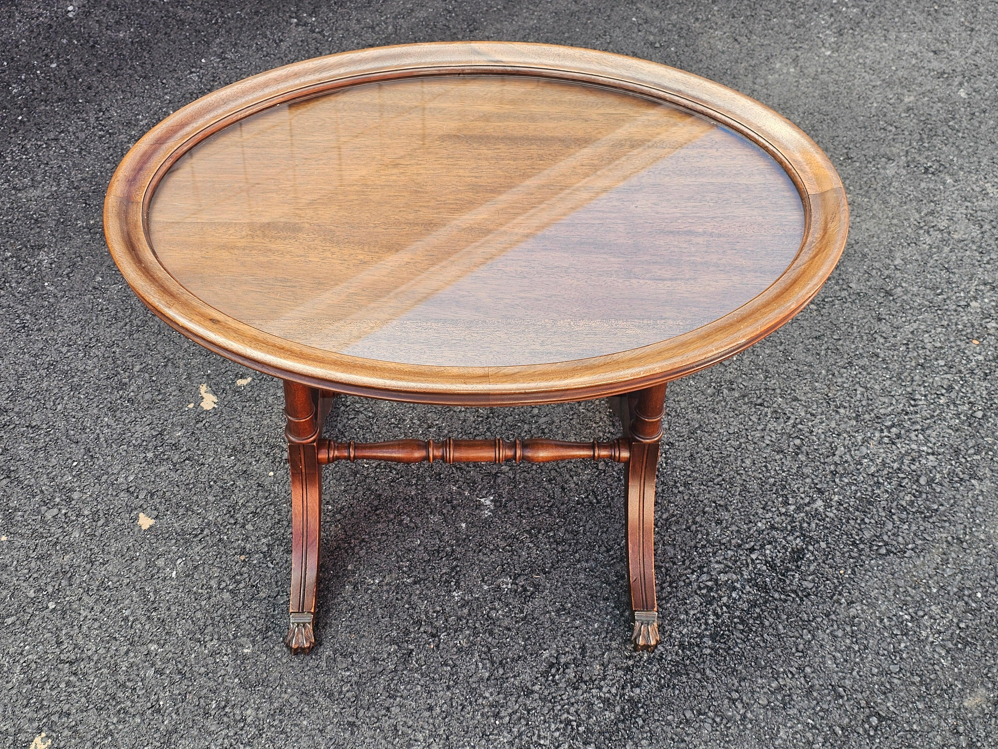 Brandt Furniture mid Century Georgian Style Mahogany Oval Glass Tray Top Side Table with Brass paw feet.
Measures 29.5