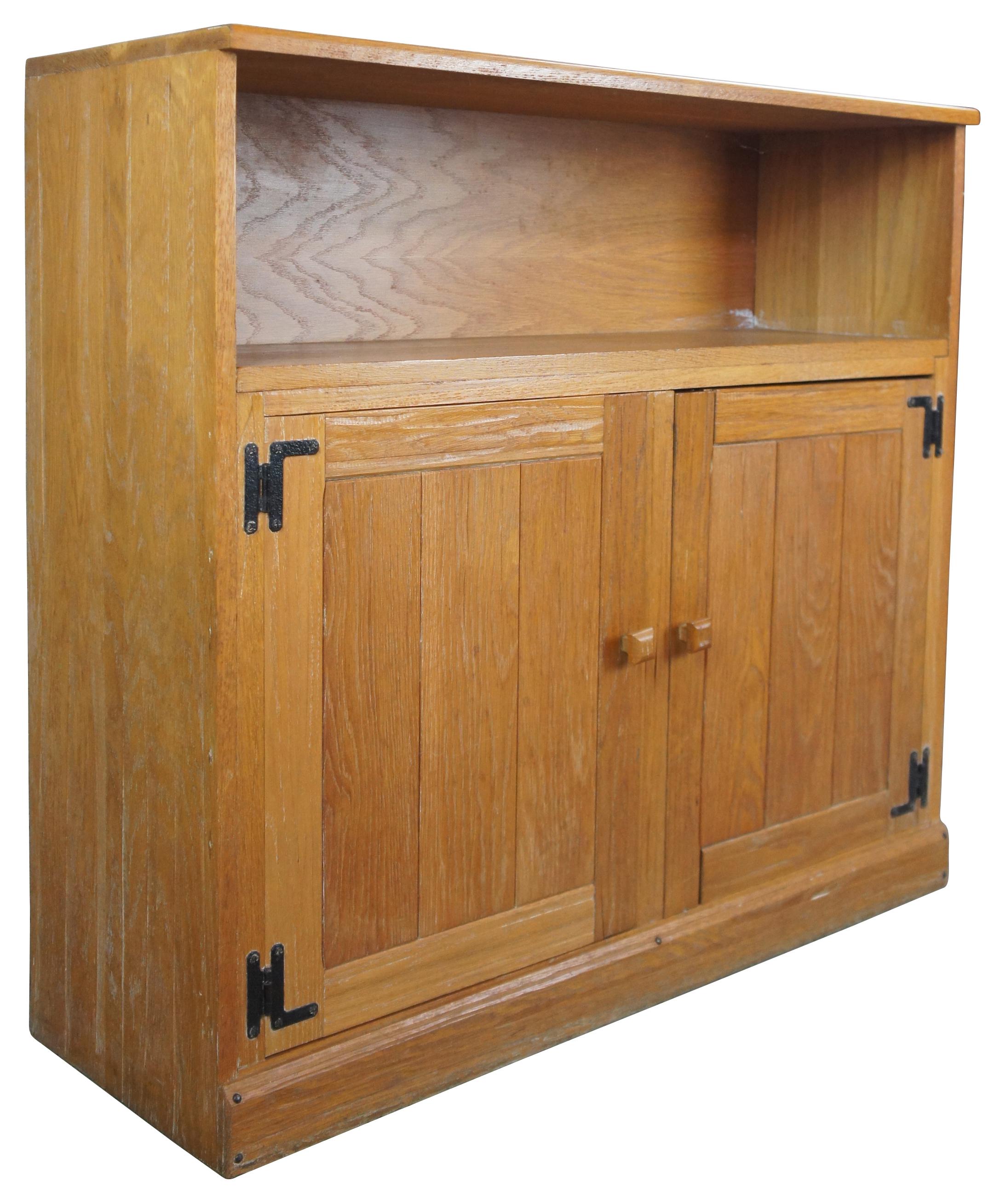 A. Brandt Ranch oak double cabinet #1891N-8 with doors, circa 1960s. The double cabinet or bookcase features a rustic design with two doors and inset shelf. Great for use as a console or media stand.
 
