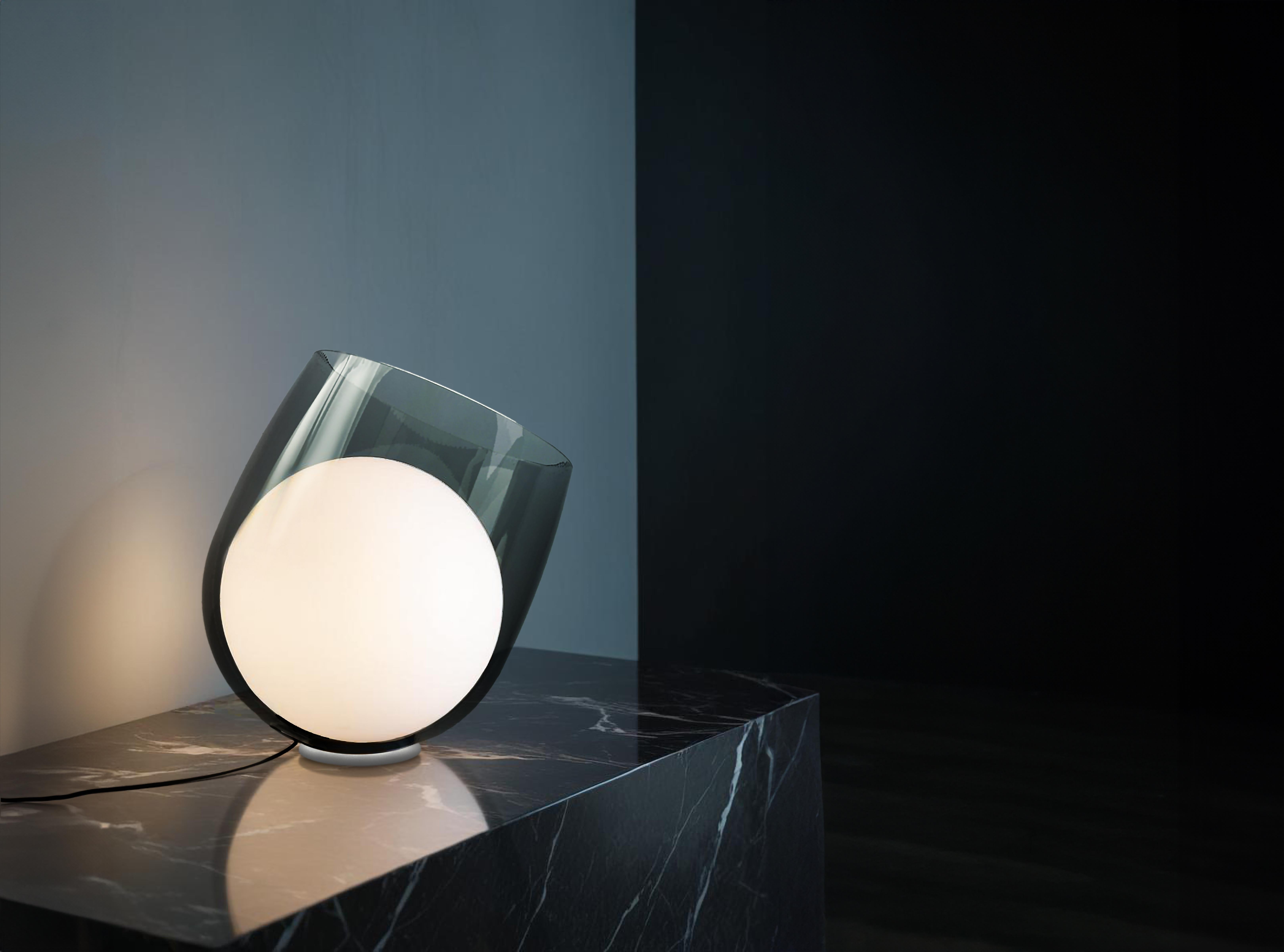 Brandy Lamp by Shulab Studio
Dimensions: W 31.8 x D 31.8 x H 34.8 cm.
Materials: Transparent Glass.

Also available in Smoke grey glass and Smoke brown glass.

Studio shulab is an internationally acclaimed design studio founded by designers  Kfir