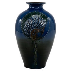 Brannam of Barnstaple. A rare blue vase decorated with a squirrel eating nuts.