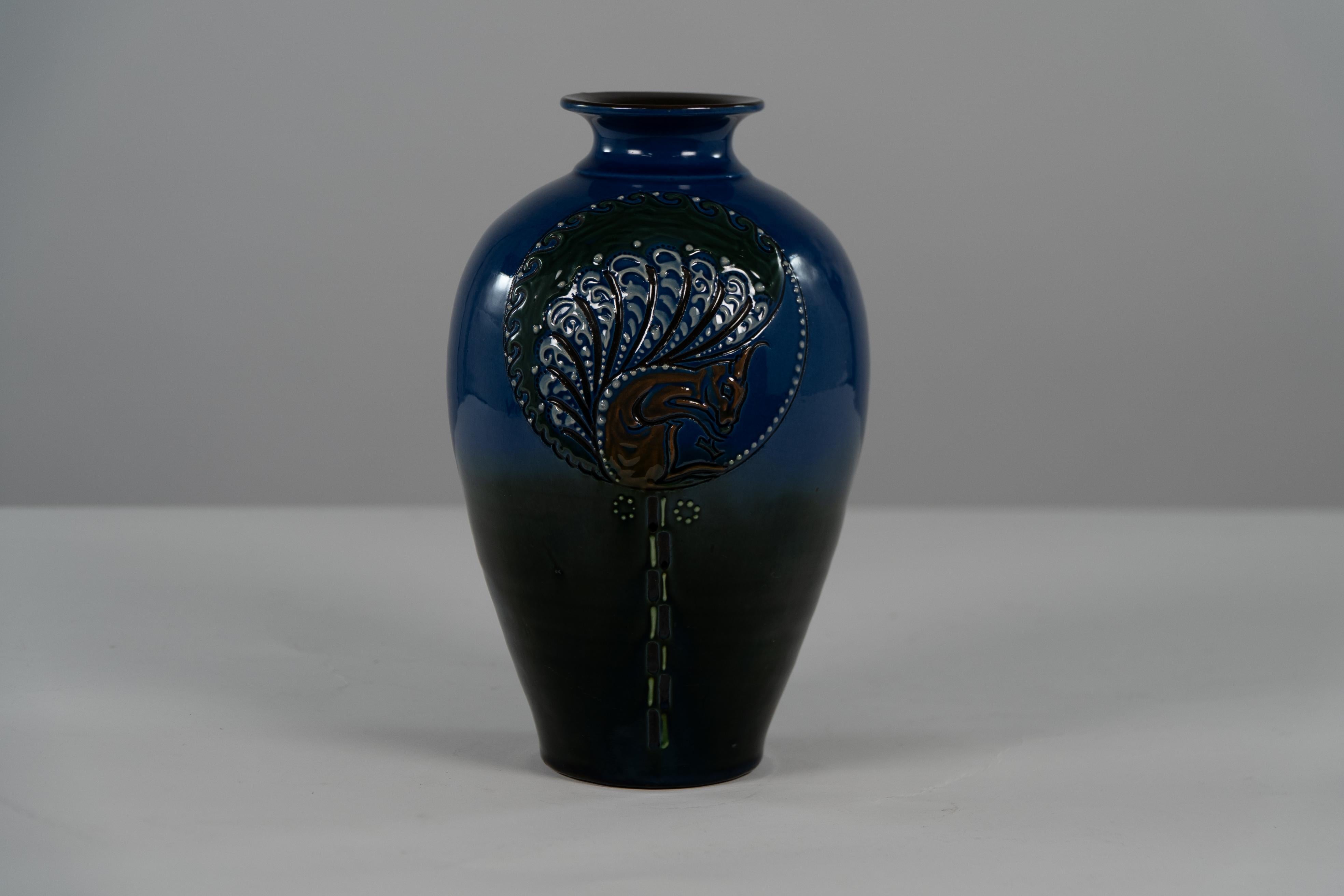 Early 20th Century Brannam of Barnstaple. A rare blue vase decorated with a squirrel eating nuts. For Sale