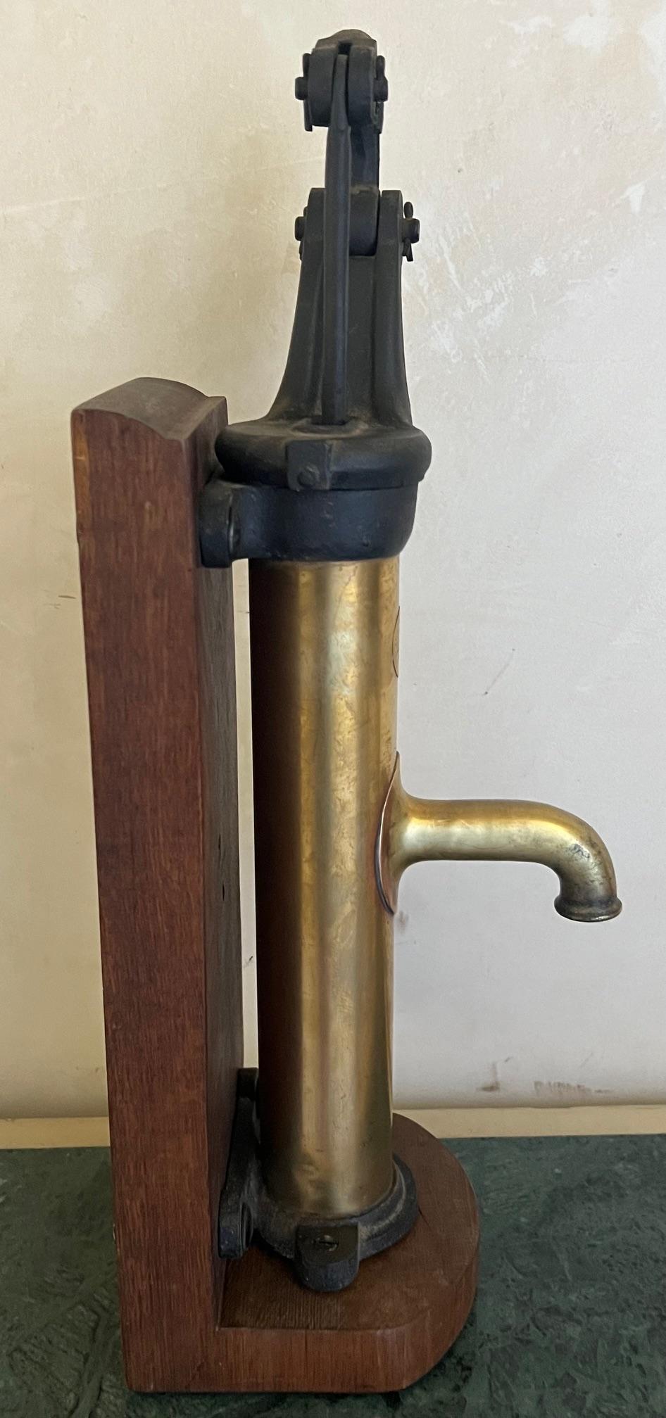 French Brass and Cast Iron Antique Pump and Spout Mounted on Wood, c. 1900 For Sale