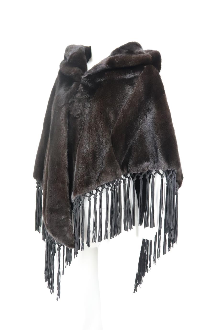 This poncho by Braschi is cut for a relaxed fit from beautifully rich brown mink fur and has a hooded neckline and is trimmed with suede fringed detail. Brown mink-fur, black suede. Hook and eye fastening at front. 100% Fur (Mink); lining: 100%