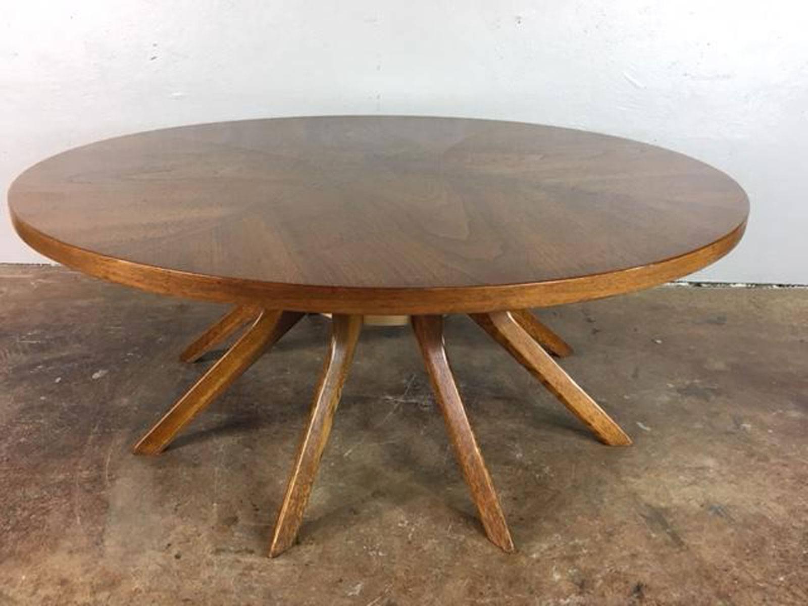 Broyhill Brasilia Cathedral coffee table, circa 1960s. Inlay walnut top and sculptural splayed legs. Overall very good condition. Sharp. Sturdy.
