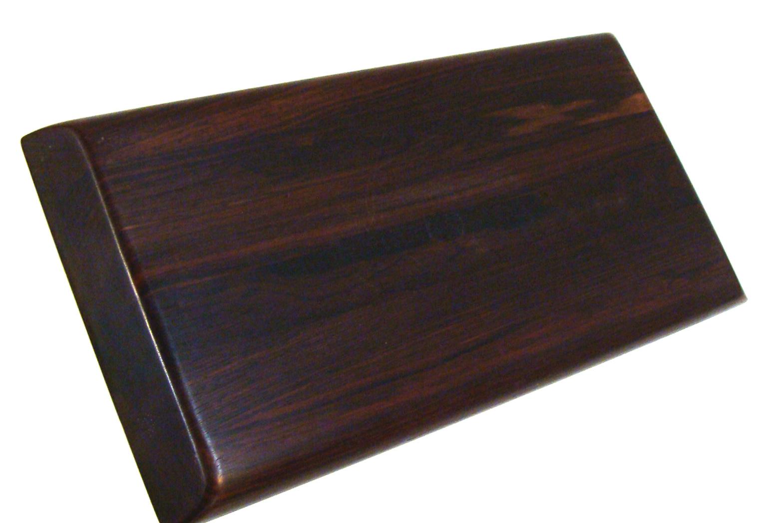 Beautiful vintage tray carved from solid Brazilian rosewood plank. Superb graining and deep color are features which places this tray in the top echelon of serving trays. Marked on underside of tray. No damage or restoration.
Minimal wear noted.