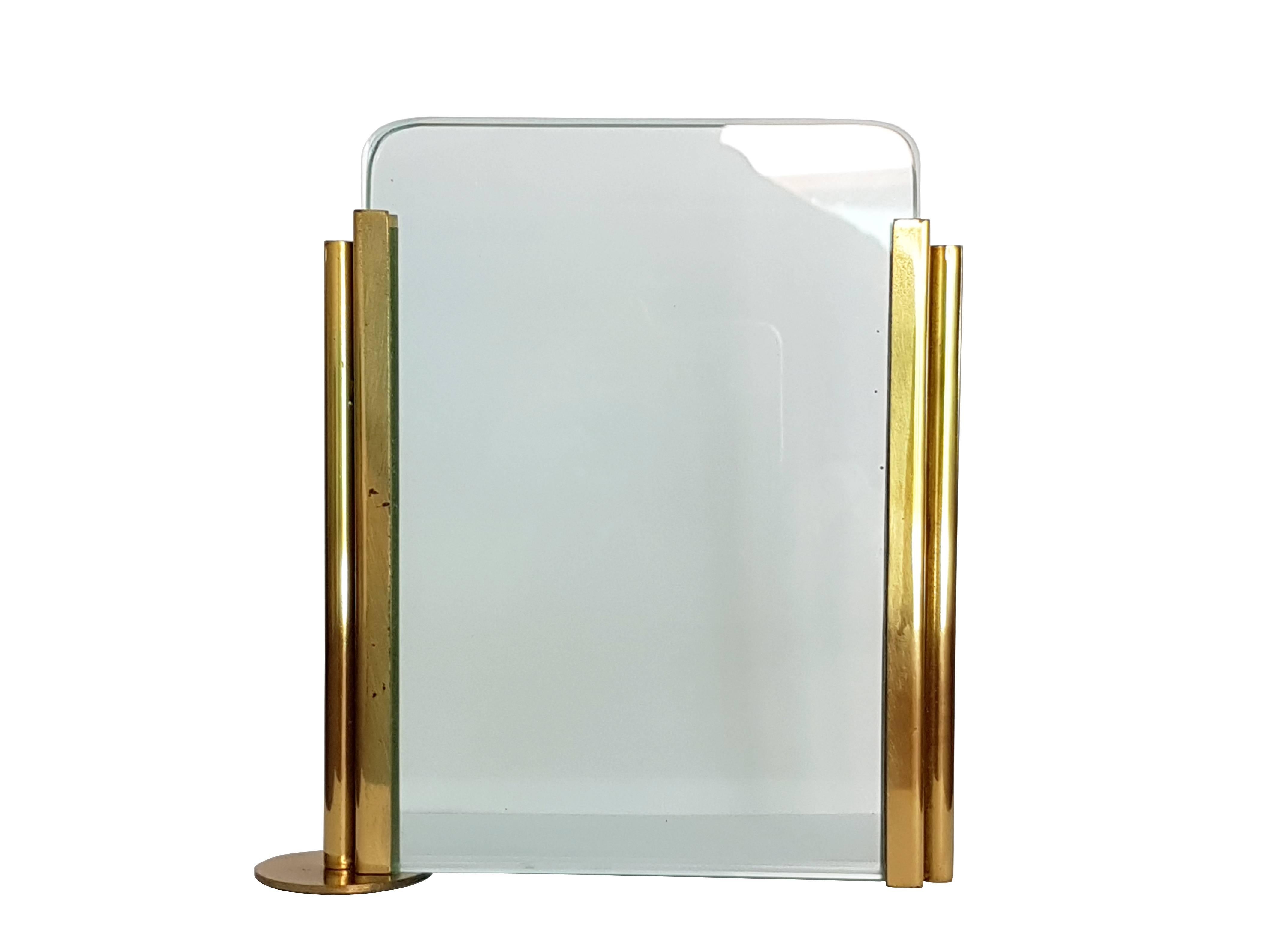 This beautiful picture frame was produced in Italy around the 1970s. It is made from a brass frame with two thick handmade glass sheets. Perfect vintage condition.