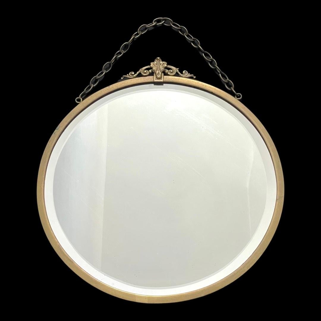  Brass 1920's Beveled Mirror with a captivating Bridge Top.

The Bridge Top, a gracefully designed crest that adorns the mirror, adds a touch of sophistication reminiscent of a bygone era. Crafted from durable brass, this mirror not only reflects