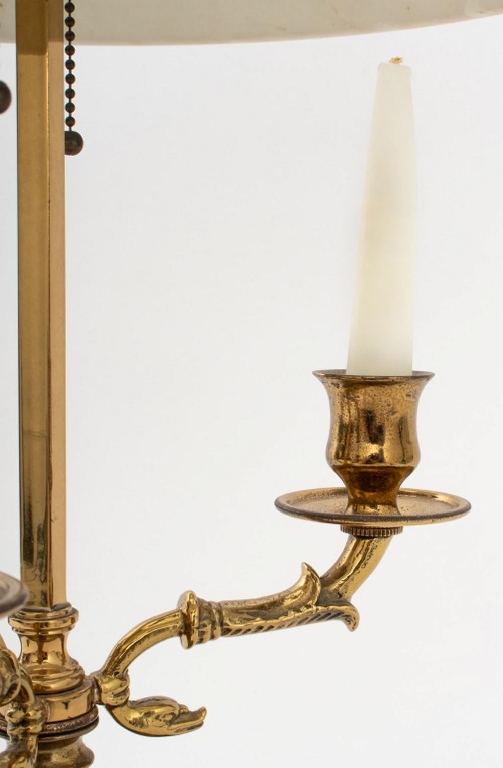 Brass Three-Branch Black Tole Peinte Shade Bouillotte Lamp, with two light bulb fittings and three candlestick holders. Overall: 24.5