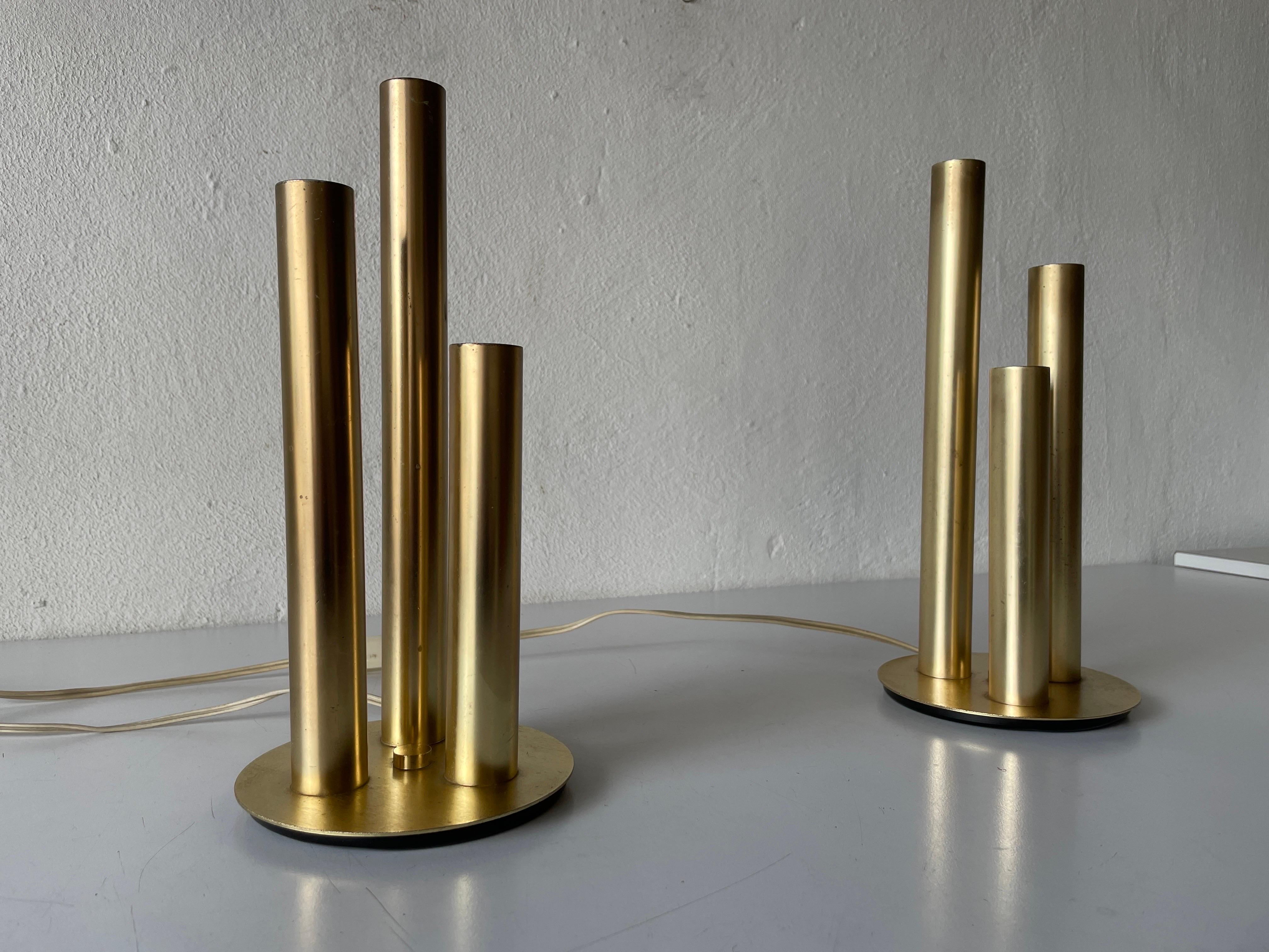 Brass 3 Cylinder Modernist Pair of Table Lamps, 1960s, Italy

Lampshade is in very good vintage condition.

It has European plug. It can be converted to other countries plugs with using converter. Also it can be rewired different type of plugs that