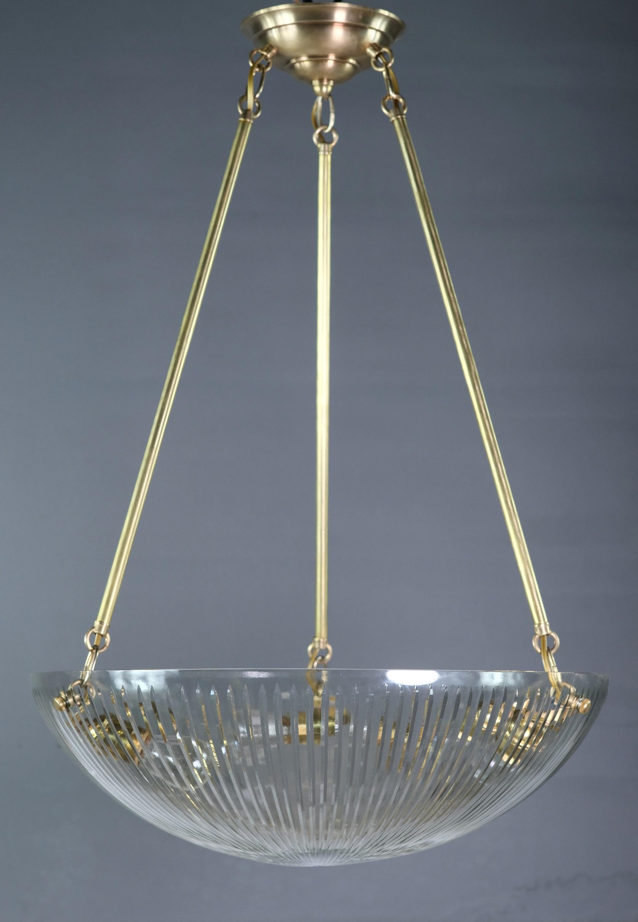 Late 20th Century pendant light with three legs mounted into a heavy clear cut glass dish shade. Holds three standard E26 light bulbs. This can be seen at our 400 Gilligan St location in Scranton, PA.