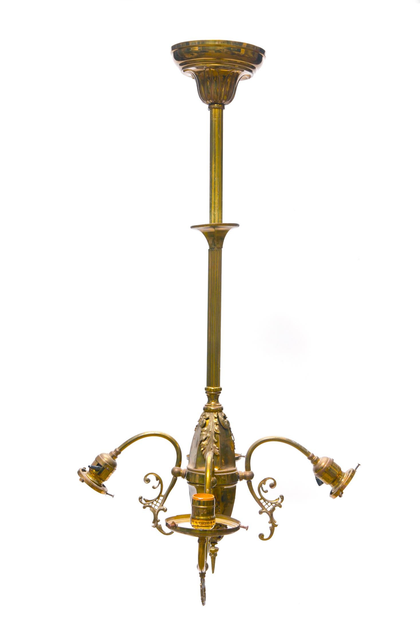 Antique light fixture, incomplete, with a high polished brass finish. 
Refined ornate details, Can be usable with some adaptation. No historical information is known about this rare and unusual piece. Original Canopy is included, some elements of
