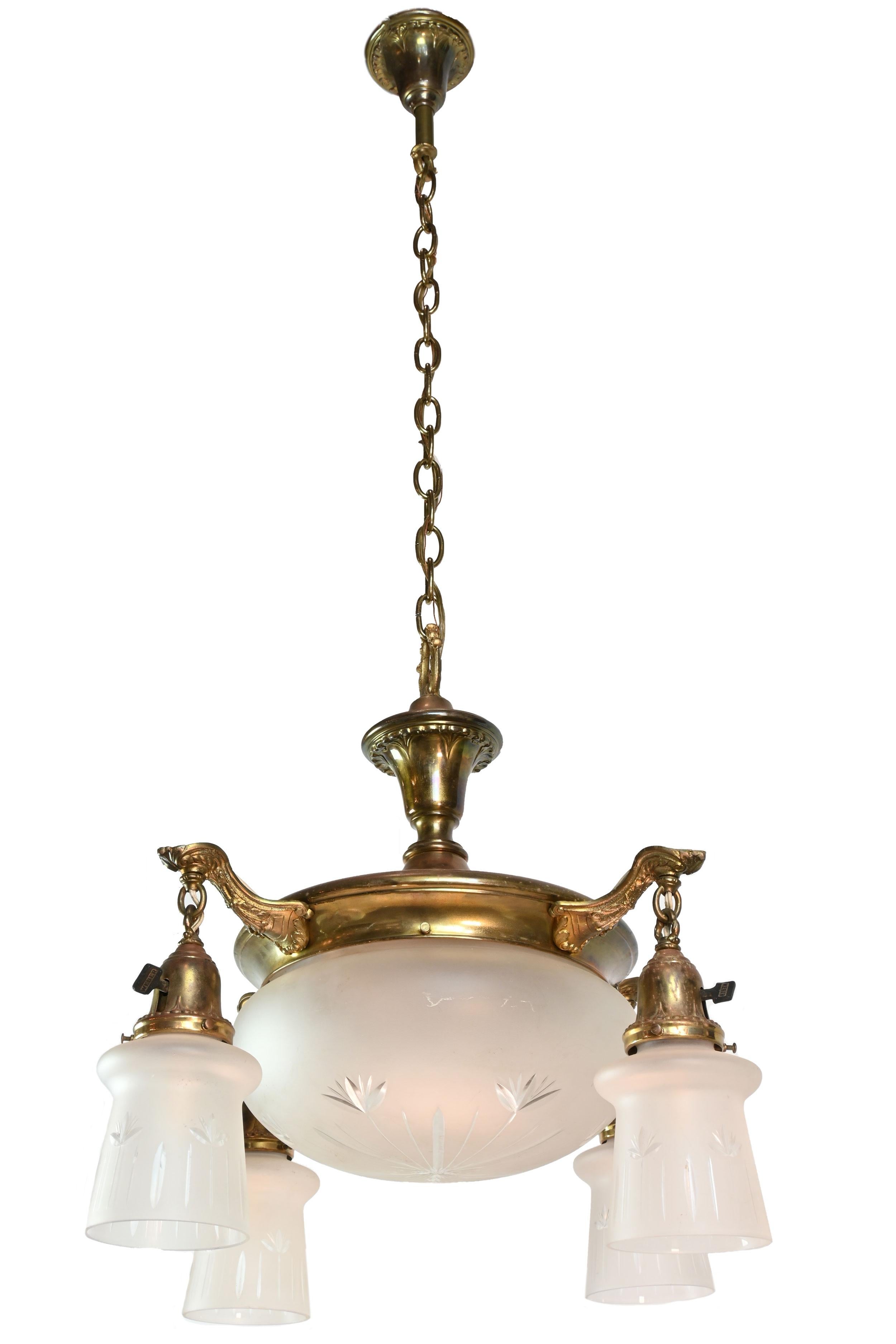 Lovely detail on this classic fixture. The etched shades feature a geometric floral pattern and each of the arms can be turned off separately from the main bowl. The beautiful organic detailing in the arms is matched by the rainbow colors of the