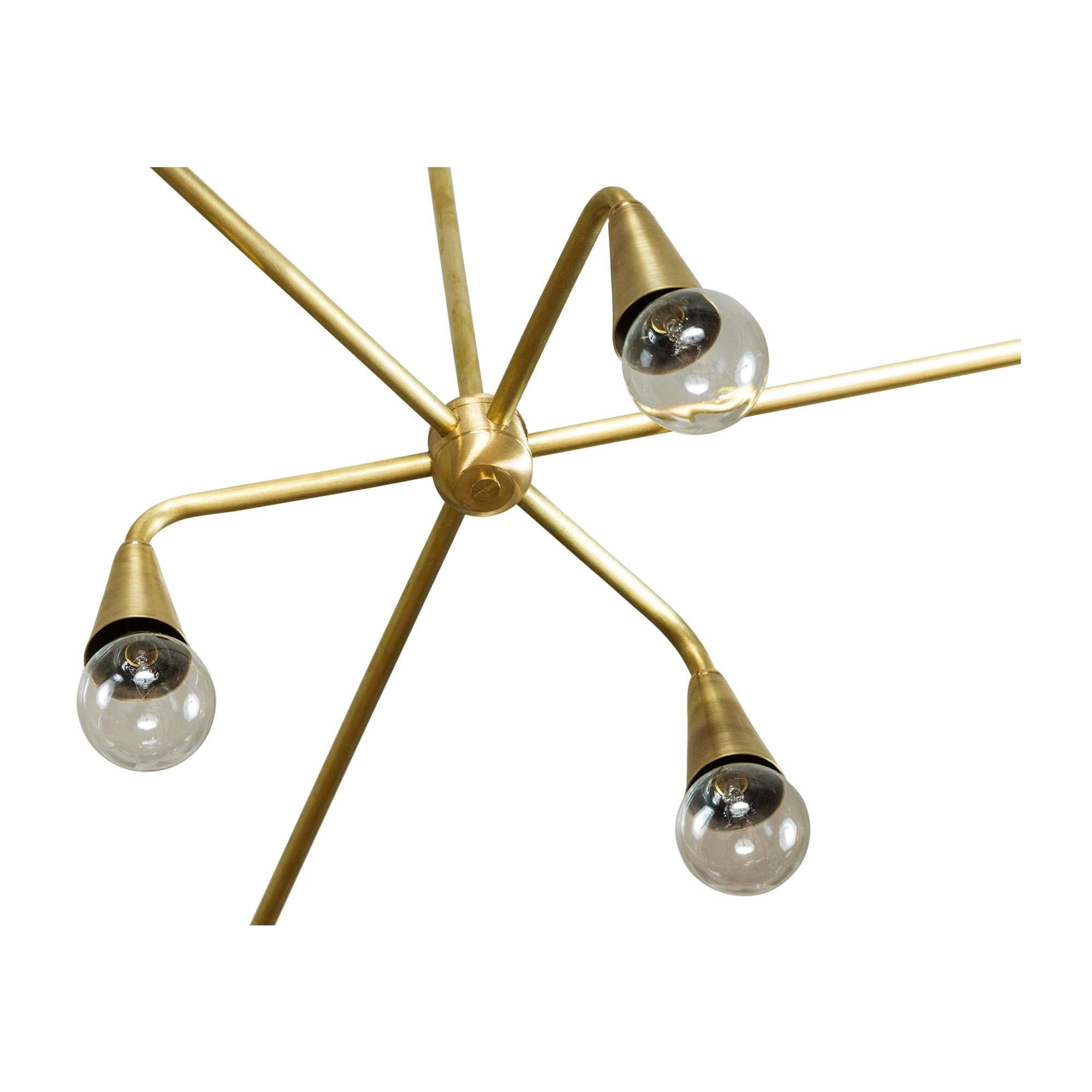 The 6-globe chandelier features six arms that are centered on a brass rod. Three of the globes are angled down with brass shades. The other three have white or black powdercoated shades.

The Lawson-Fenning Collection is designed and handmade in Los