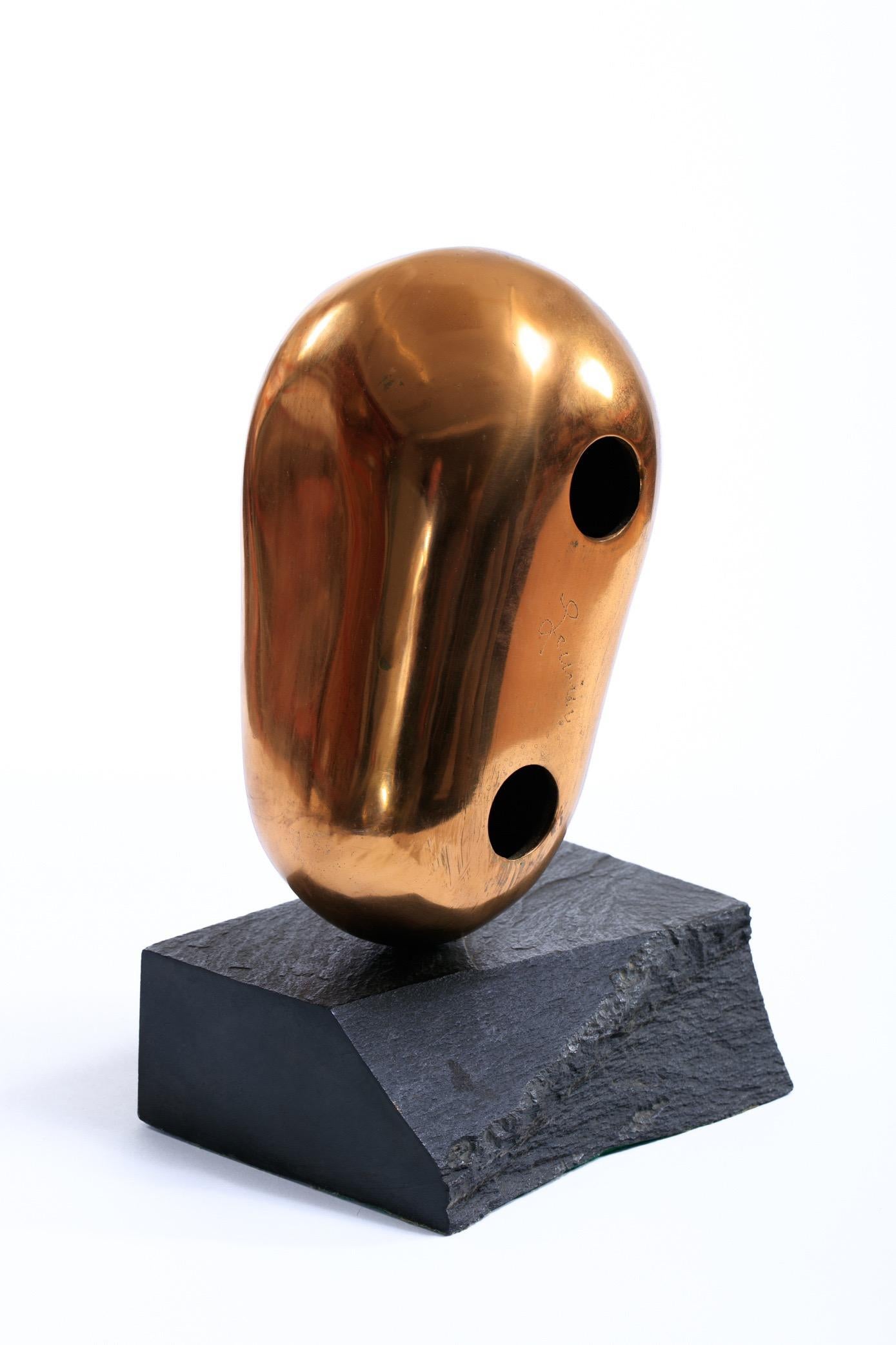 Abstract Gold /  Brass head sculpture on black marble base, signed on face of sculpture 