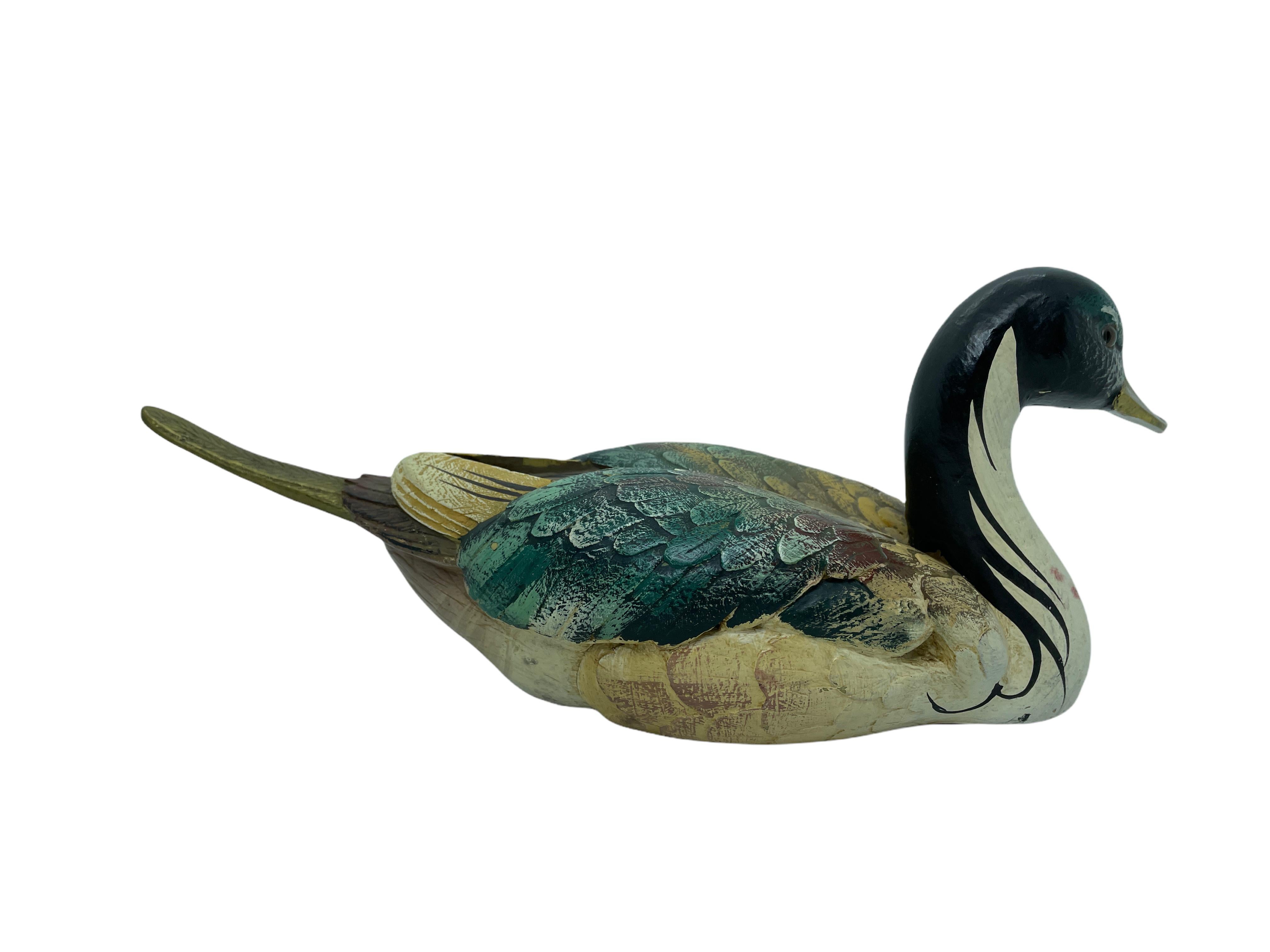 Vintage signed duck figurine by Malevolti, Italy. It features a decoy type design with brass accented parts. It has glass eyes and a hand painted body. A nice addition to the Hollywood Regency interior. Signed Malevolti Italy.