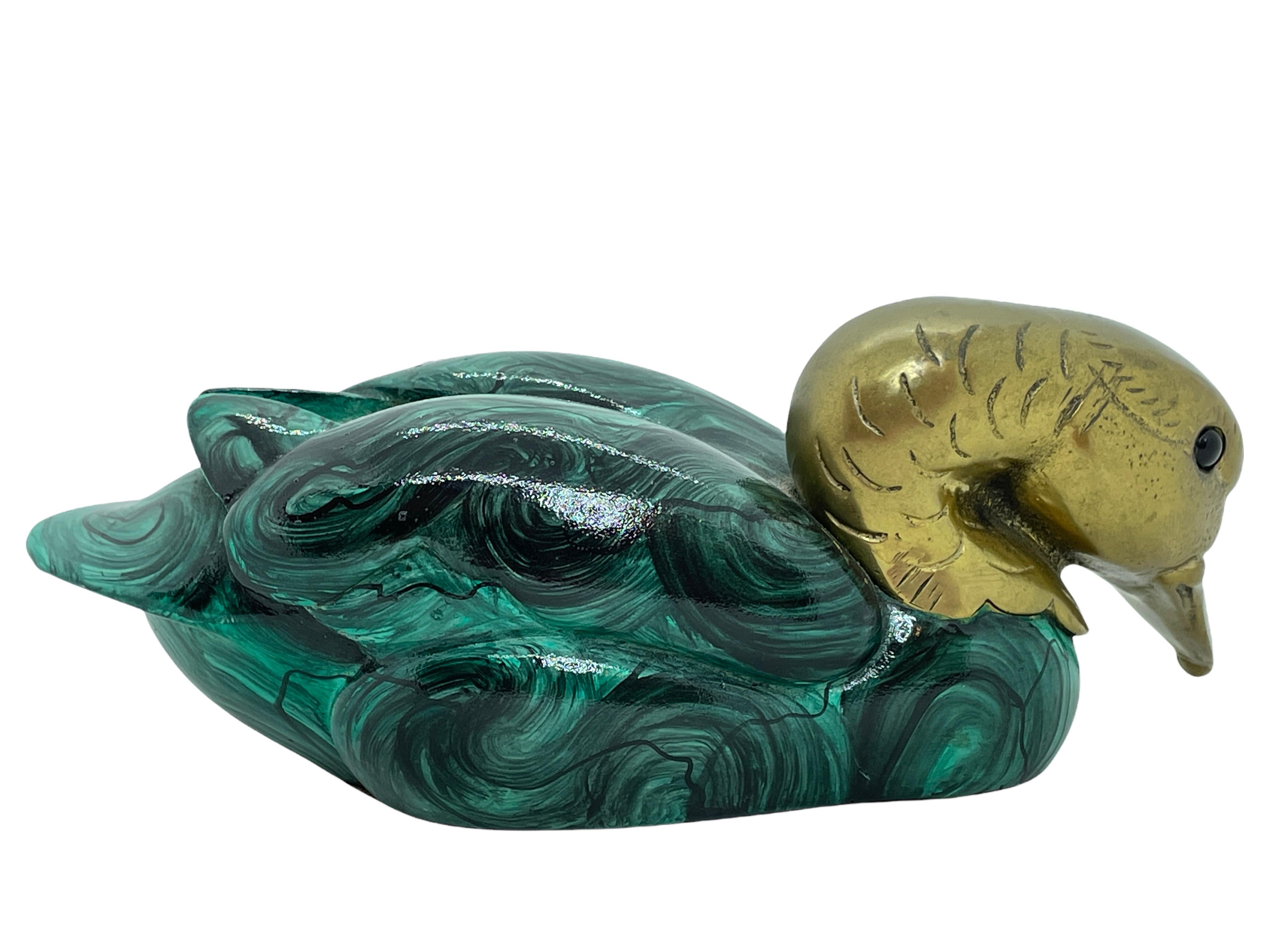 Vintage duck figurine by Malevolti, Italy. It features a decoy type design with brass accented parts. It has glass eyes and jade green body. A nice addition to the Hollywood Regency interior. Not Signed but its Malevolti Italy, the label is missing.